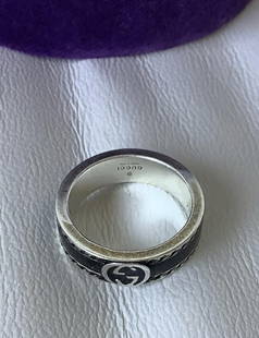 GUCCI Signed Sterling Silver Ring Made In Italy With Box: GUCCI Signed Sterling Silver Ring Size 19 Crafted of sterling silver, this Gucci piece reflects the brand's iconic Italian craftsmanship. Its sleek design adds a touch of understated elegance to any c