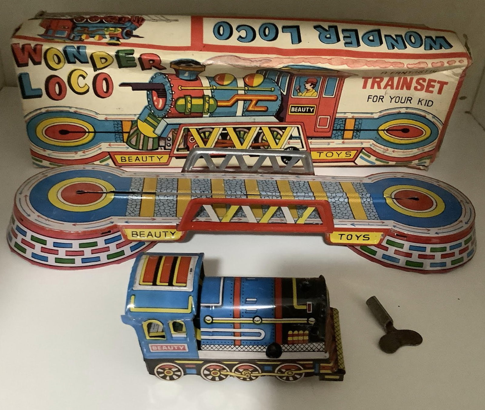 Tin Litho Wind Up Wonder Loco Train With Key and Orig Box: Tin Litho Wind Up Wonder Loco Train With Key and Orig Box. Measures approx 10 3/4 inches long