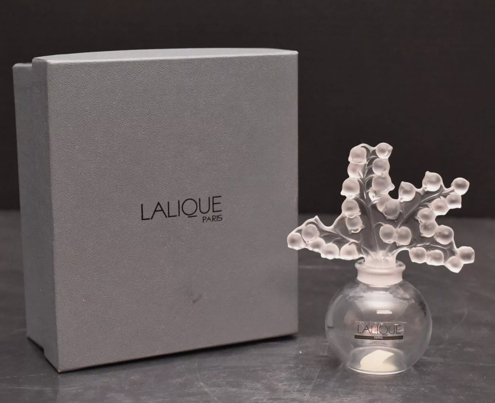 Lalique Signed Clairefontaine Lily of the Valley Glass Crystal Perfume Bottle With Original Box: Lalique Signed Clairefontaine Lily of the Valley Glass Crystal Perfume Bottle With Original Box. Measures approx over 5 inches tall no chips or cracks