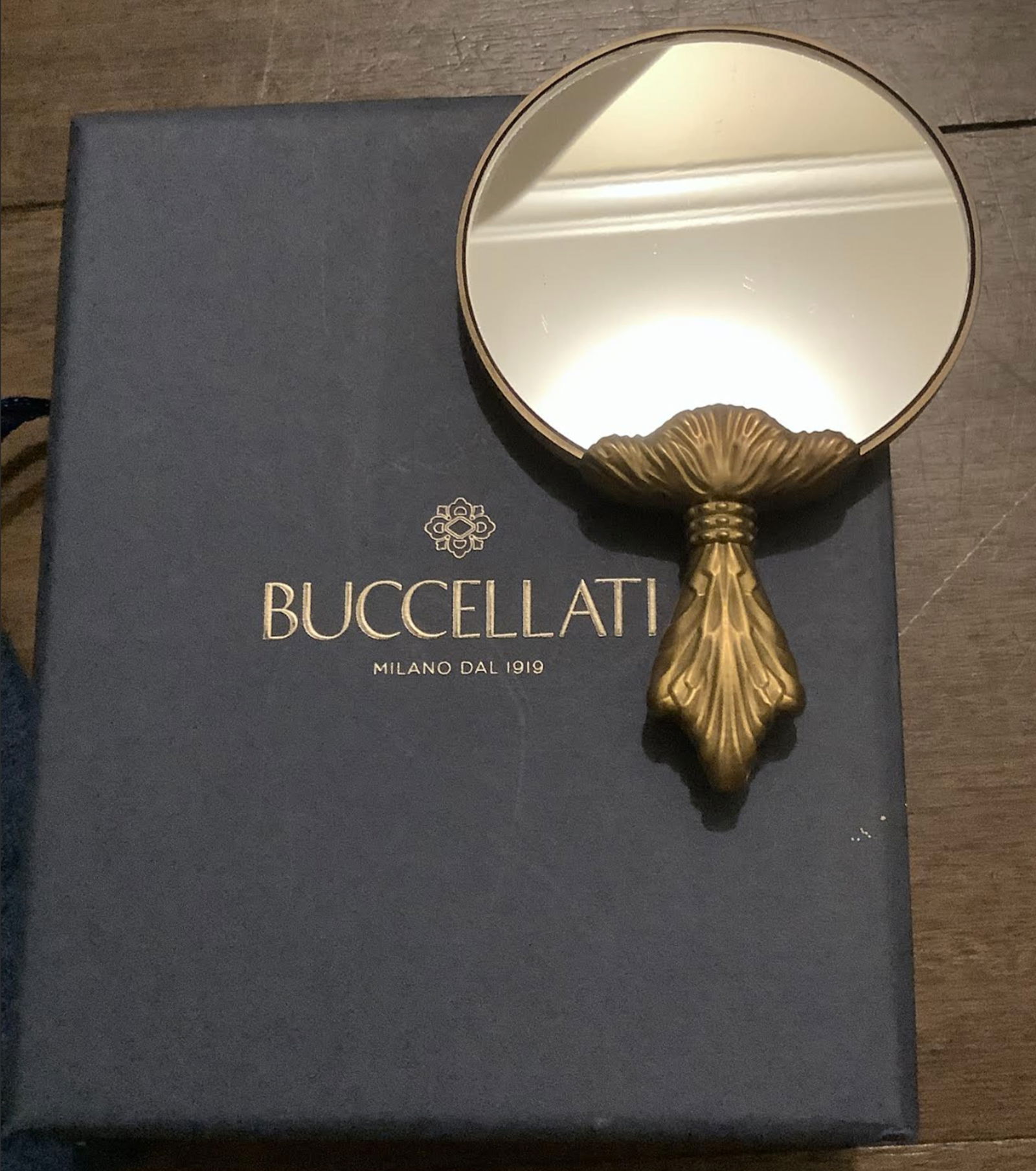Buccellati Mirror With Orig Box and Pouch: Buccellati Mirror With Orig Box and PouchMirror with box Measures approx 4 inches high2.5 inches at widest point. Comes with Box, Pouch and ribbon see images