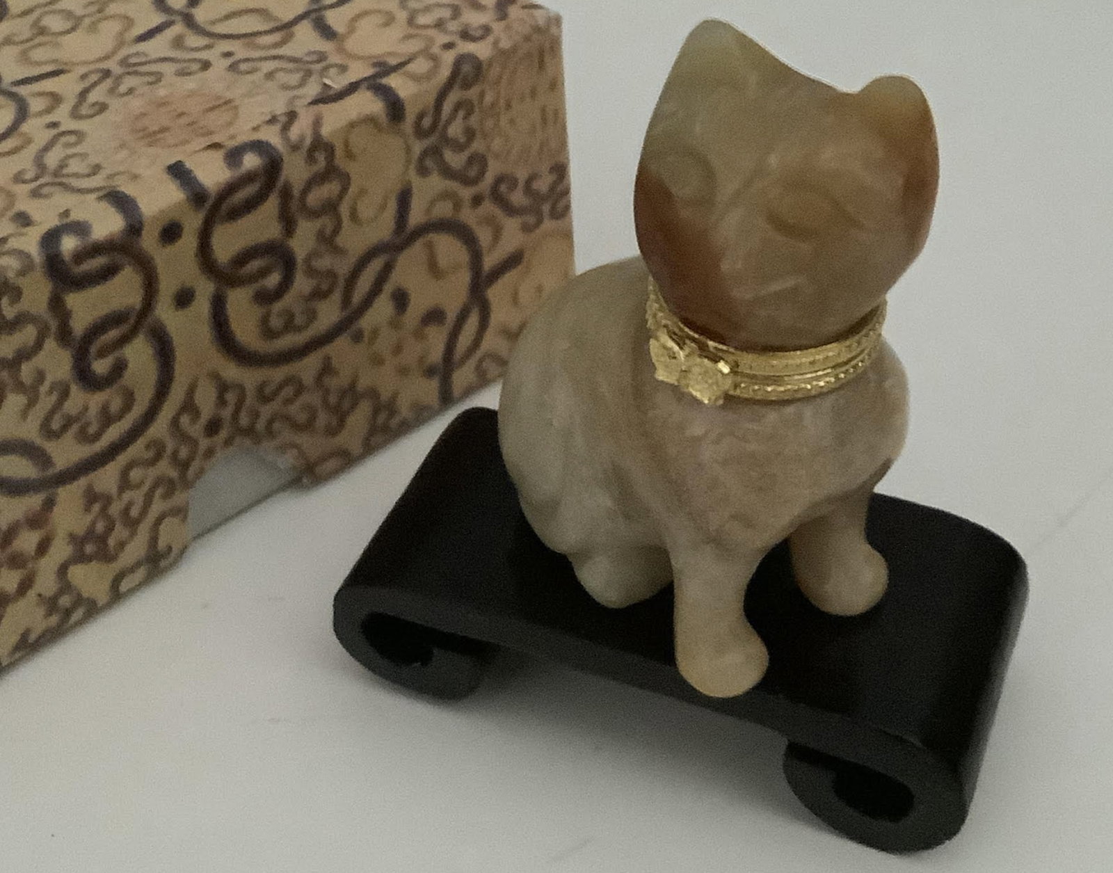 Jade Cat Figurine With Wooden Stand and Box: Jade Cat Figurine With Wooden Stand and Box. Mesures approx 2 inches tall1.5 linches long no chips or cracks present.