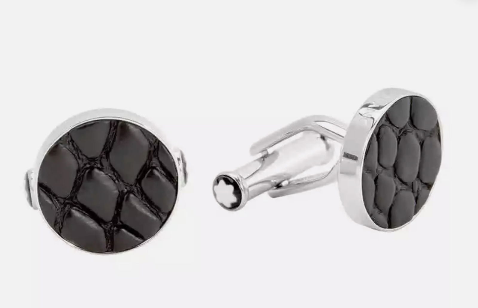 Montblanc Essential Sartorial cufflinks in round stainless steel with black leather at the center: Montblanc Essential Sartorial cufflinks in round stainless steel with black leather at the center. Size: Appx. 16mm.