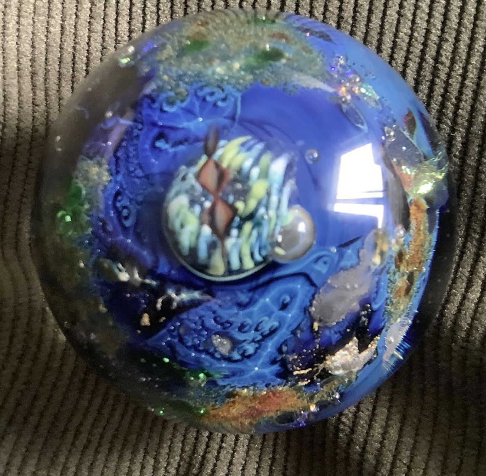 Josh Simpson Signed Inhabited Planet Marble Art Glass Paperweight: Josh Simpson Signed Inhabited Planet Marble Measues approx 1.5" . No chips oracks