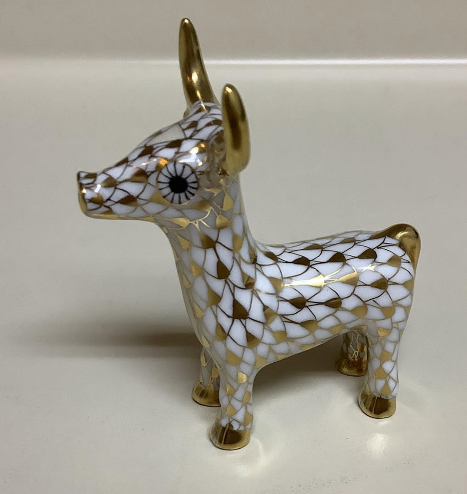 Herend signed porcelain gold fishnet calf figurine: Herend signed porcelain gold fishnet calf figurine. 2.5 inches wide by 2 3/4 inches tall