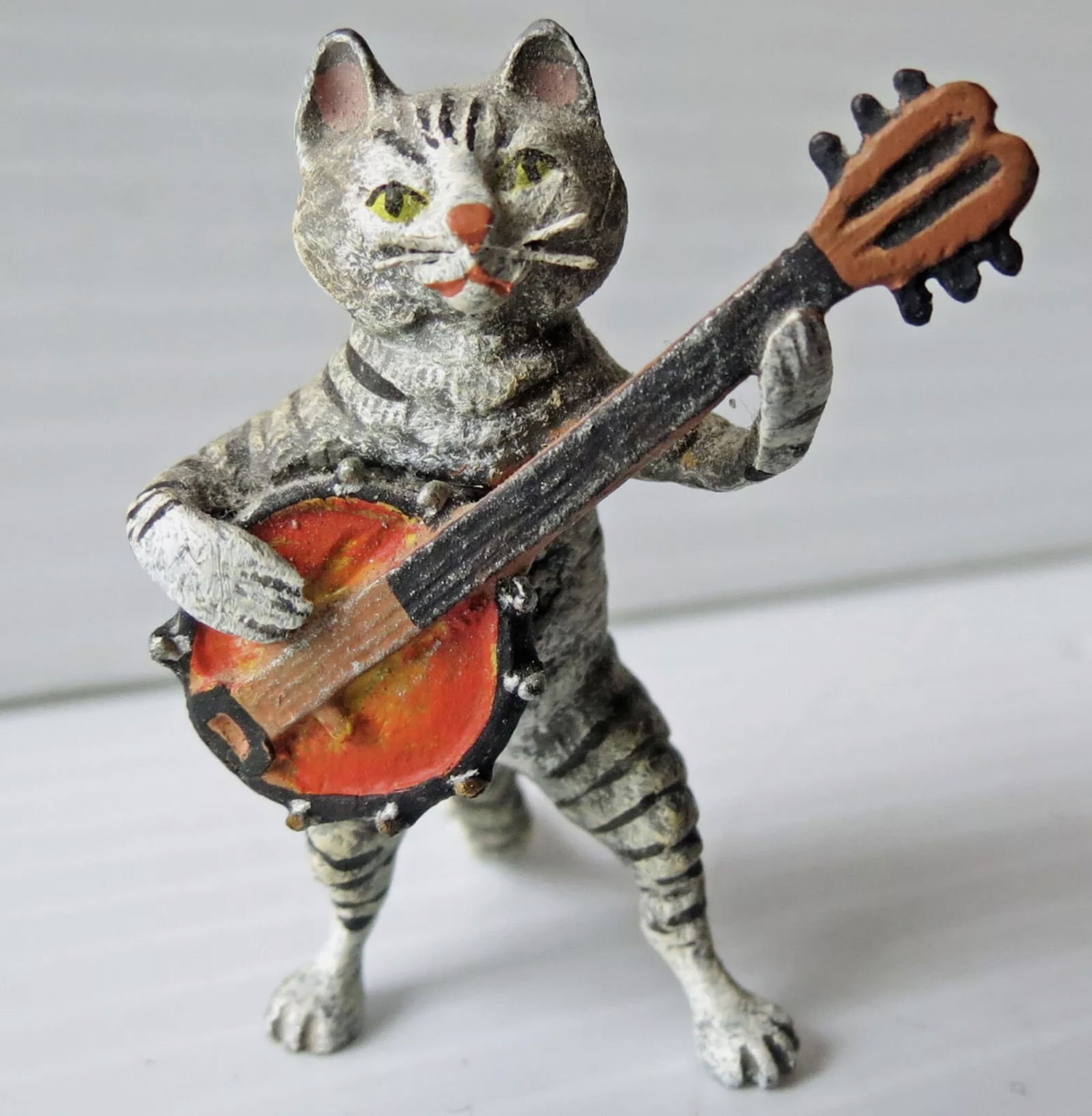 Fritz Bermann Austrian Vienna Bronze Cat playing a banjo. FBW: Fritz Bermann Austrian Vienna Bronze Cat playing a banjo. FBW. The sculpture is cold painted with a lot of detail down to the whiskers. It measures 1 1/2” tall x 1 1/2” wide x 2” dee