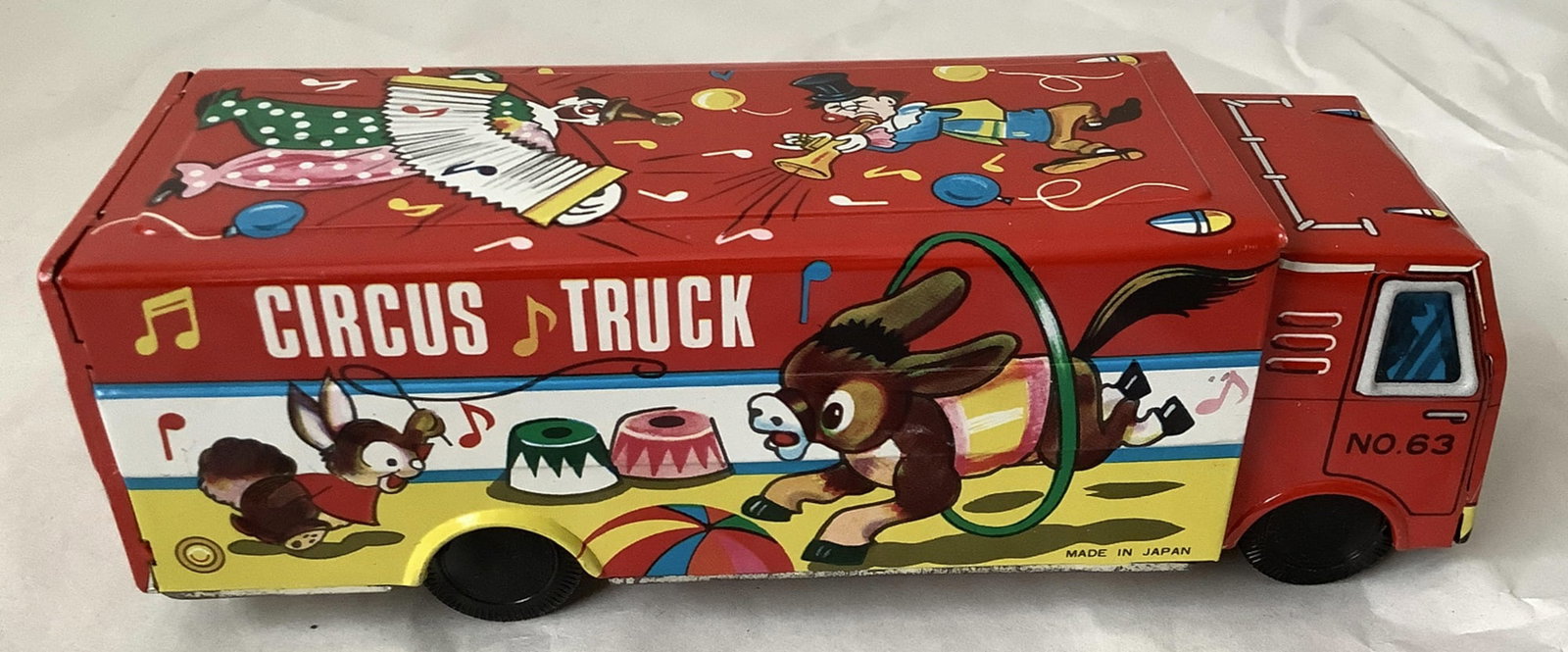 Japanese Tin Circus Truck #63: Japanese Tin circus truck #63 Measures approx 8 inches long and 3 inches tall