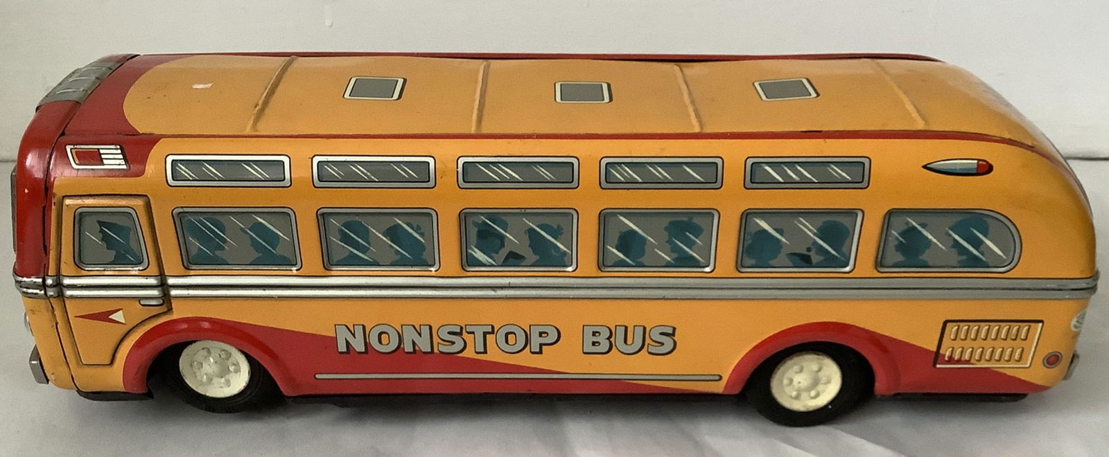 Japanese Tin Litho Battery Operateed Bus By TRADE MARK MODERN TOYS JAPAN: Japanese Tin Litho Battery Operateed Bus Measures approx 14 inches lond and 4.5 inches high TRADE MARK MODERN TOYS JAPAN