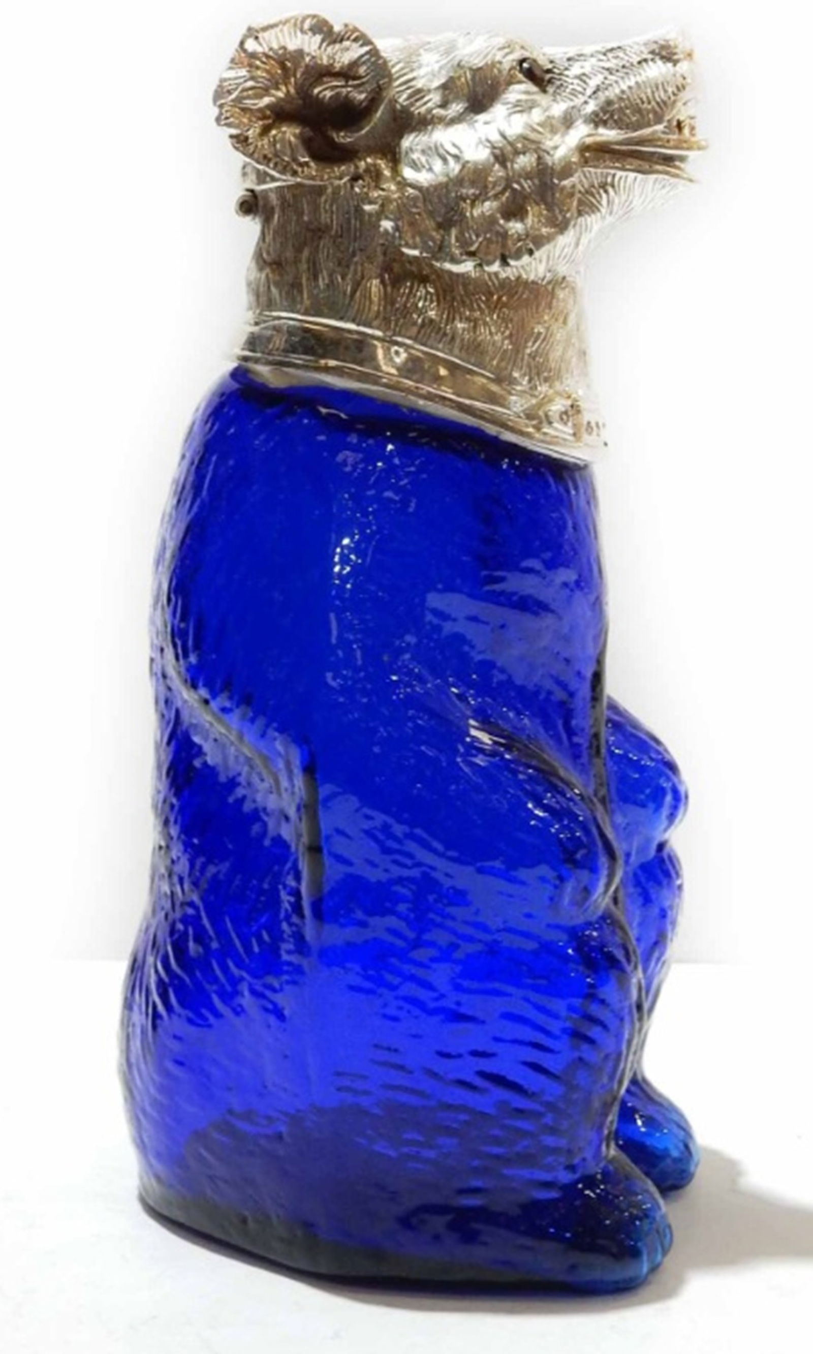 Victorian style French Blue Bear Jug Decanter.: Victorian style French Blue Bear Jug Decanter. The glass body of the Bear is a stunning blue color. The Bear has a silverplated head with glass eyes. The silverplate is stamped on the back of the Bear