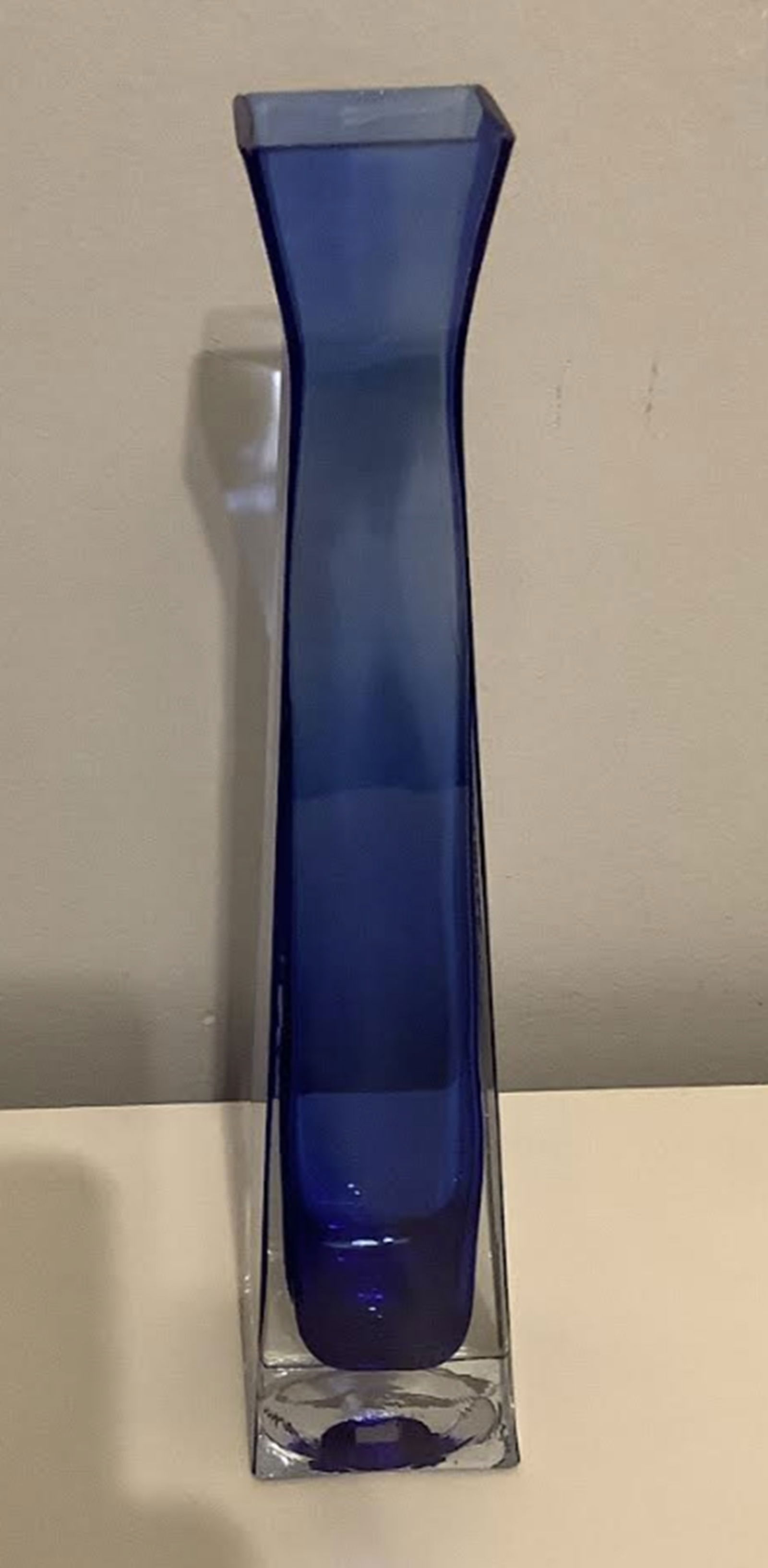 Sapphire Blue Tall GLass Vase Made in Thailand: Sapphire Blue tall glass Vase Made in Thailand. Measures approx 11 inches tall2.25 inches at its base. no chips or cracks present