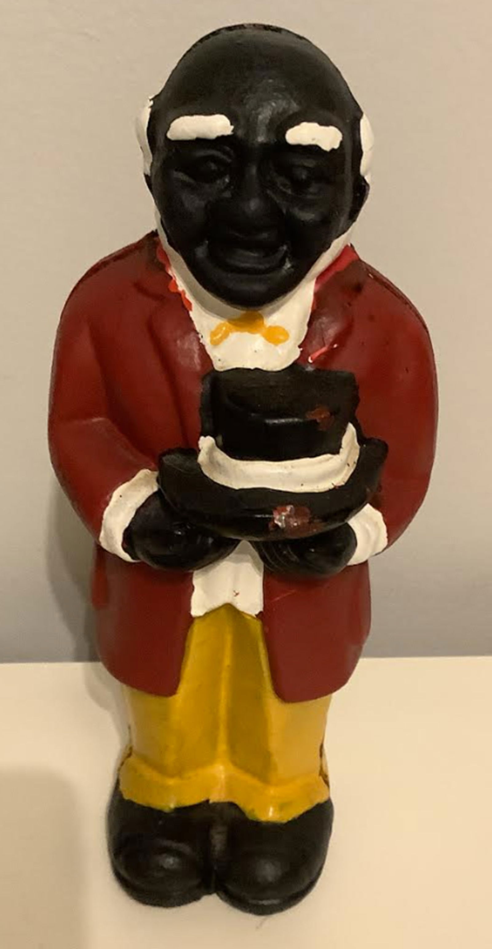 Black Americana Uncle Mose Cast Iron Bank Statutette Figurine.: Black Americana Uncle Mose Cast Iron Bank Statutette Figurine.. Measures approx 8 inches tall and 3.25 inches at widest point