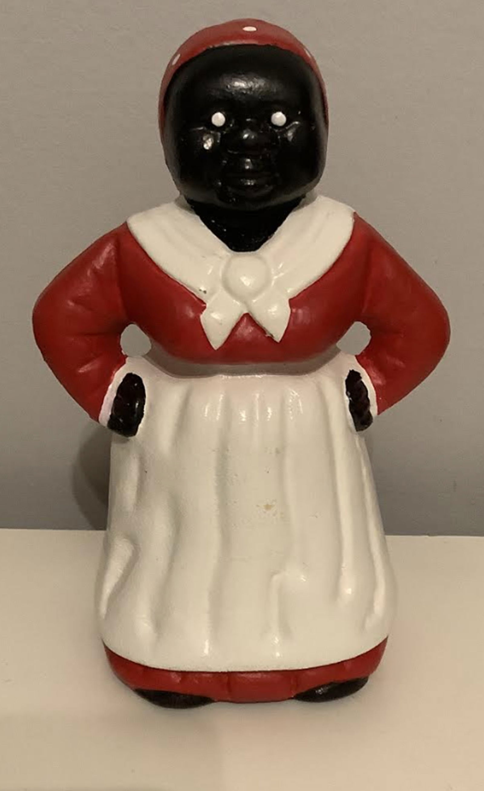 Black Americana Aunt Jemima Cast Iron Bank Statutette Figurine.: Black Americana Aunt Jemima Cast Iron Bank Statutette Figurine. Measures approx 8 inches tall and 4.5 inches at widest point