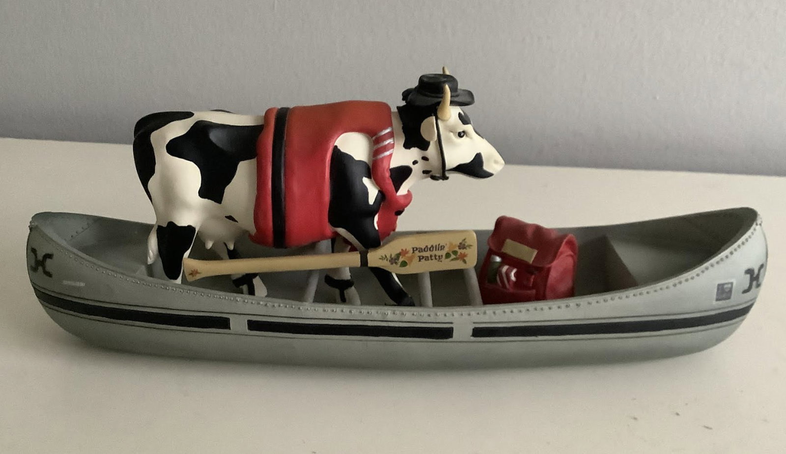 Cow Parade "Moovin' on Down the Mighty Mo" 9138 Cow In A Boat Canoe: Cow Parade "Moovin' on Down the Mighty Mo" Cow In A Boat Canoe 9138 Measure approx 10.25 inches long