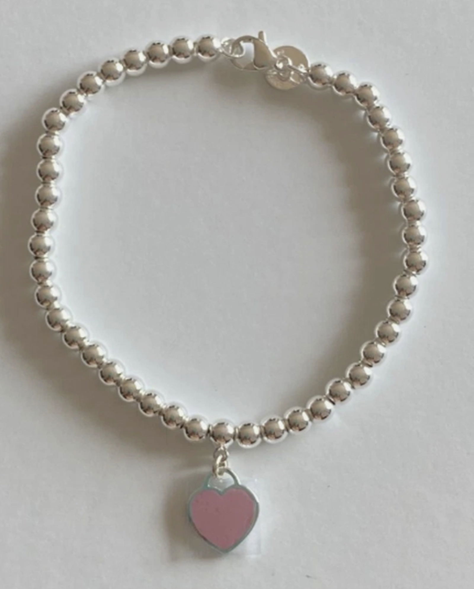 Tiffany & Co. Sterling Silver Pink Enamel Heart Bracelet: Tiffany & Co. Sterling Silver Pink Enamel Heart Bracelet