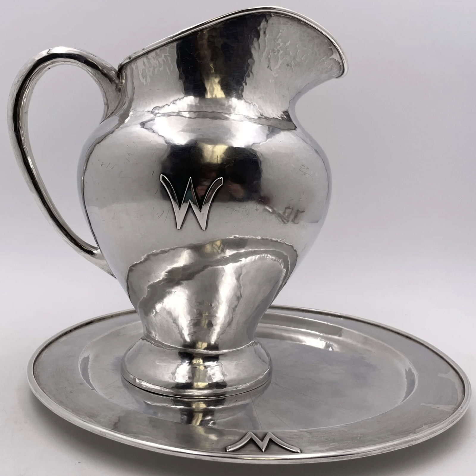 F. Novick Chicago Arts & Crafts Sterling Silver Hammered Pitcher on Tray: F. Novick Chicago Arts & Crafts Sterling Silver Hammered Pitcher on Tray. Falick Novick, sterling silver handwrought (hand-hammered) sterling silver pitcher on a matching tray, in Chicago Arts & Craft