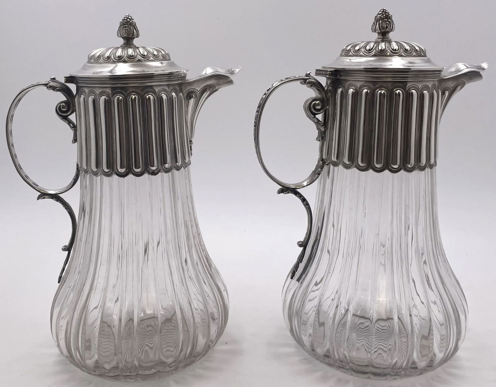 Pair of French Sterling Silver and Cut Glass Carafes/ Pitchers from Late 19th Century: Pair of French Sterling Silver and Cut Glass Carafes/ Pitchers from Late 19th Century. Pair of French 0.950 (higher purity than sterling) silver and cut-glass carafes or pitchers from the late 19th ce