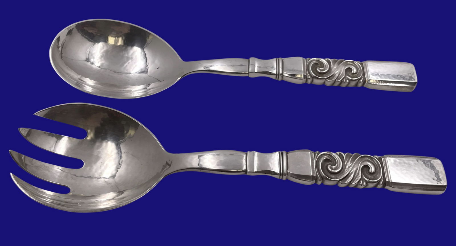 Georg Jensen Sterling Silver Salad Server Set in Scroll Pattern: Georg Jensen Sterling Silver Salad Server Set in Scroll Pattern.Georg Jensen sterling silver 2-piece salad set (fork and spoon), beautifully hand-hammered, in the celebrated Scroll pattern, with an el