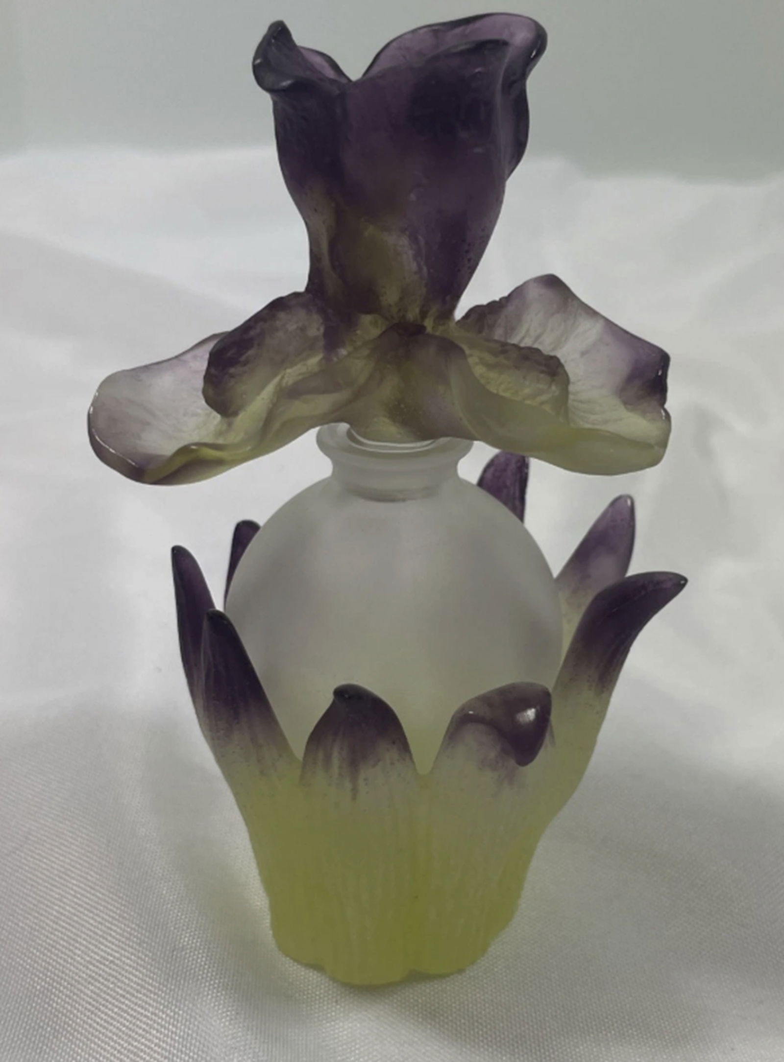 Daum Pate De Verre Iris Perfume Bottle In Orig Box: Daum Pate De Verre Iris Perfume Bottle In Orig Box. Measures approx 3 inches diameter x 5 inches tallaDaum France Pate-De-Verre glass Iris flower perfume bottle. Multi-colors of green, purple, and cle