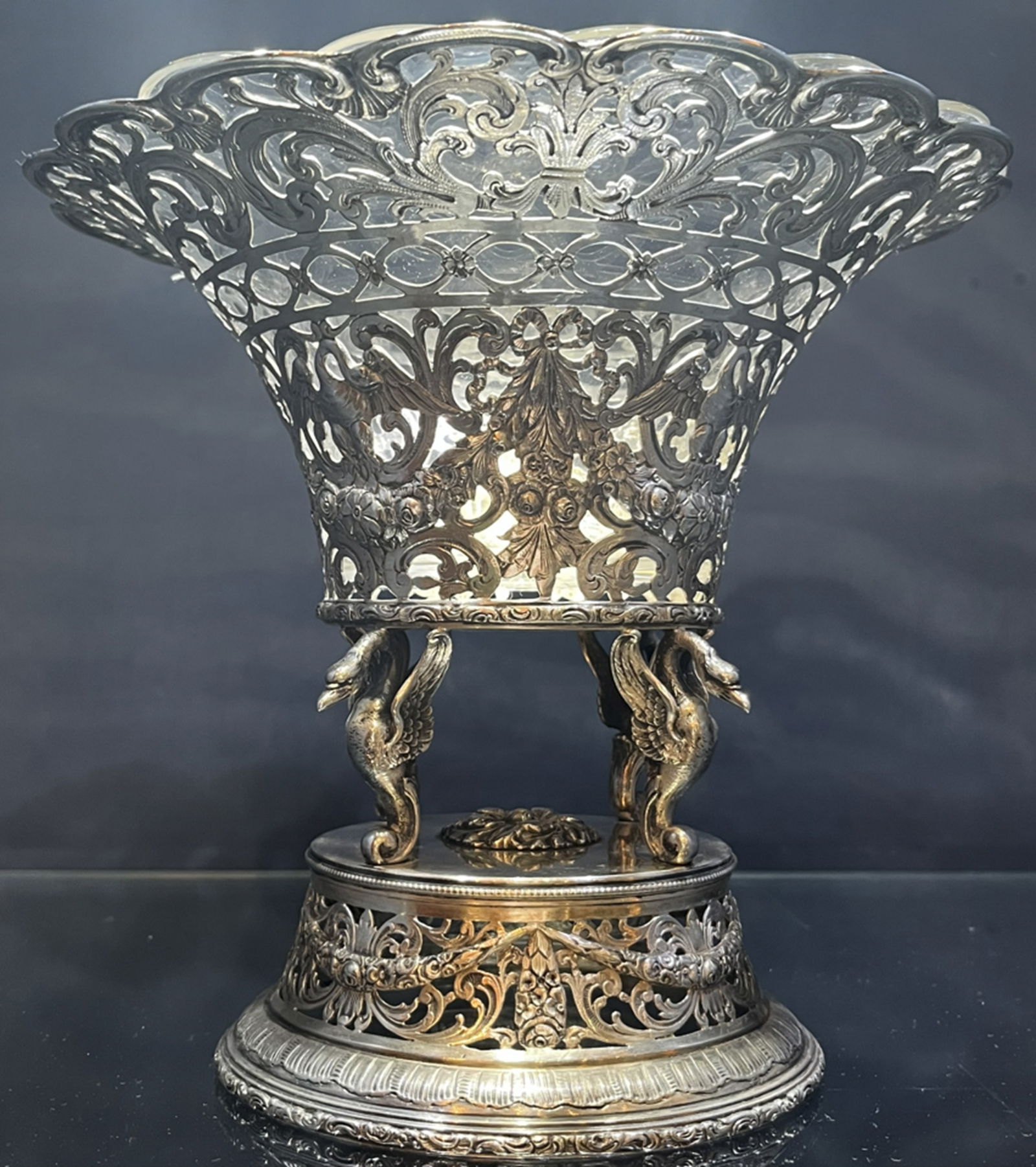 German Sterling Silver Centerpiece Bowl: German centerpiece in sterling silver. Its removable interior glass makes it perfect as a container for any kind of food or decorations. Measures approx High : 21 CM Wide : 24 CM Weight : 800 grams