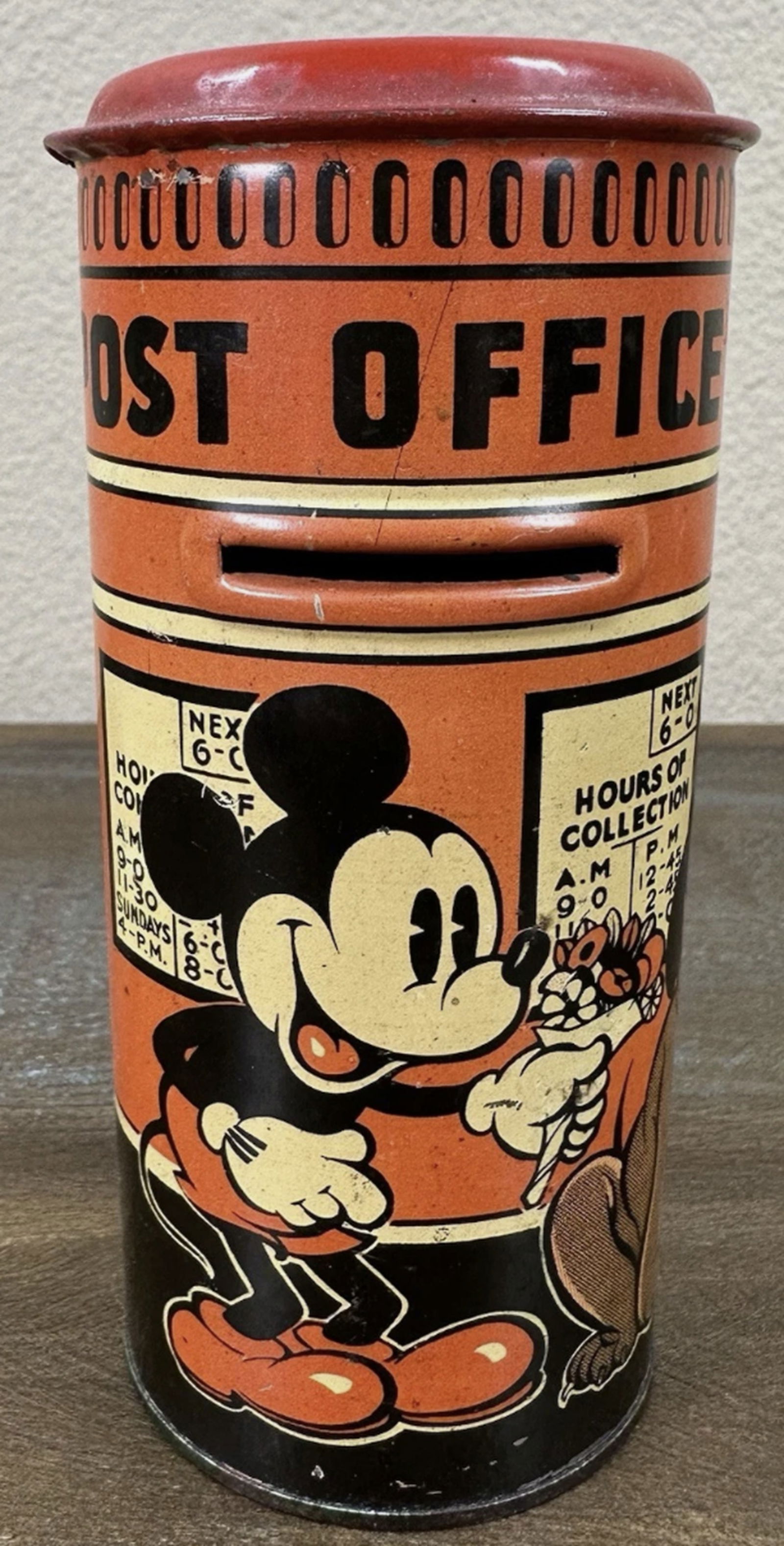 Disney Happy Bank Tin Litho Bank Mickey Mouse Post Office Bank 1930: Disney Happy Bank Tin Litho Bank Mickey Mouse Post Office Bank 1930 Signs of wear of its old age Made in Great Britian. 6" tall, 2 3/4" across. Pretty good shape for something approaching 100 years ol