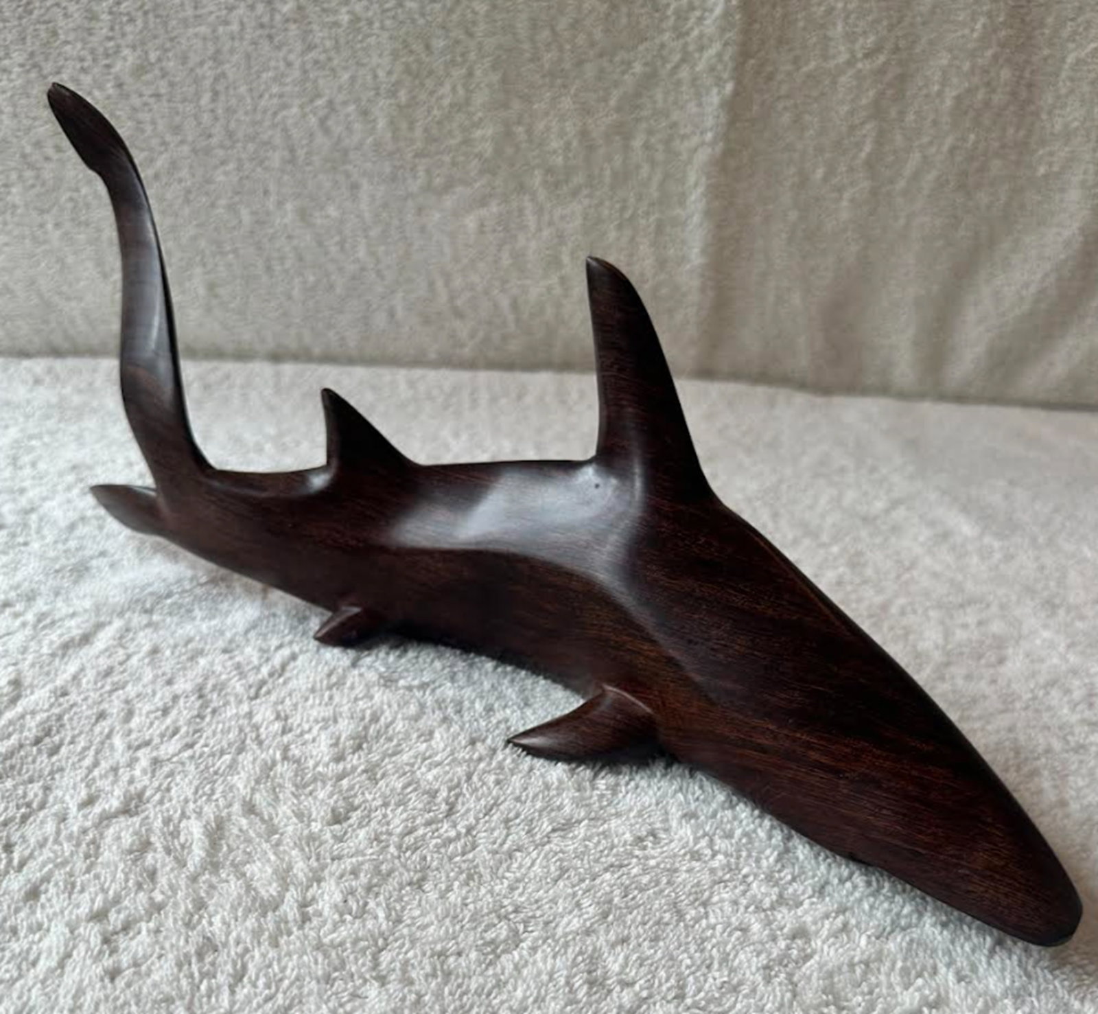 Hand Carved Ironwood Shark Figurine Statuette Circa 1984: Carved in the early 80’s by a Seri artist named Alexandro Diaz, this ironwood sculpture depicts a shark in fluid motion, its elongated form suggesting effortless movement through water. This piece b