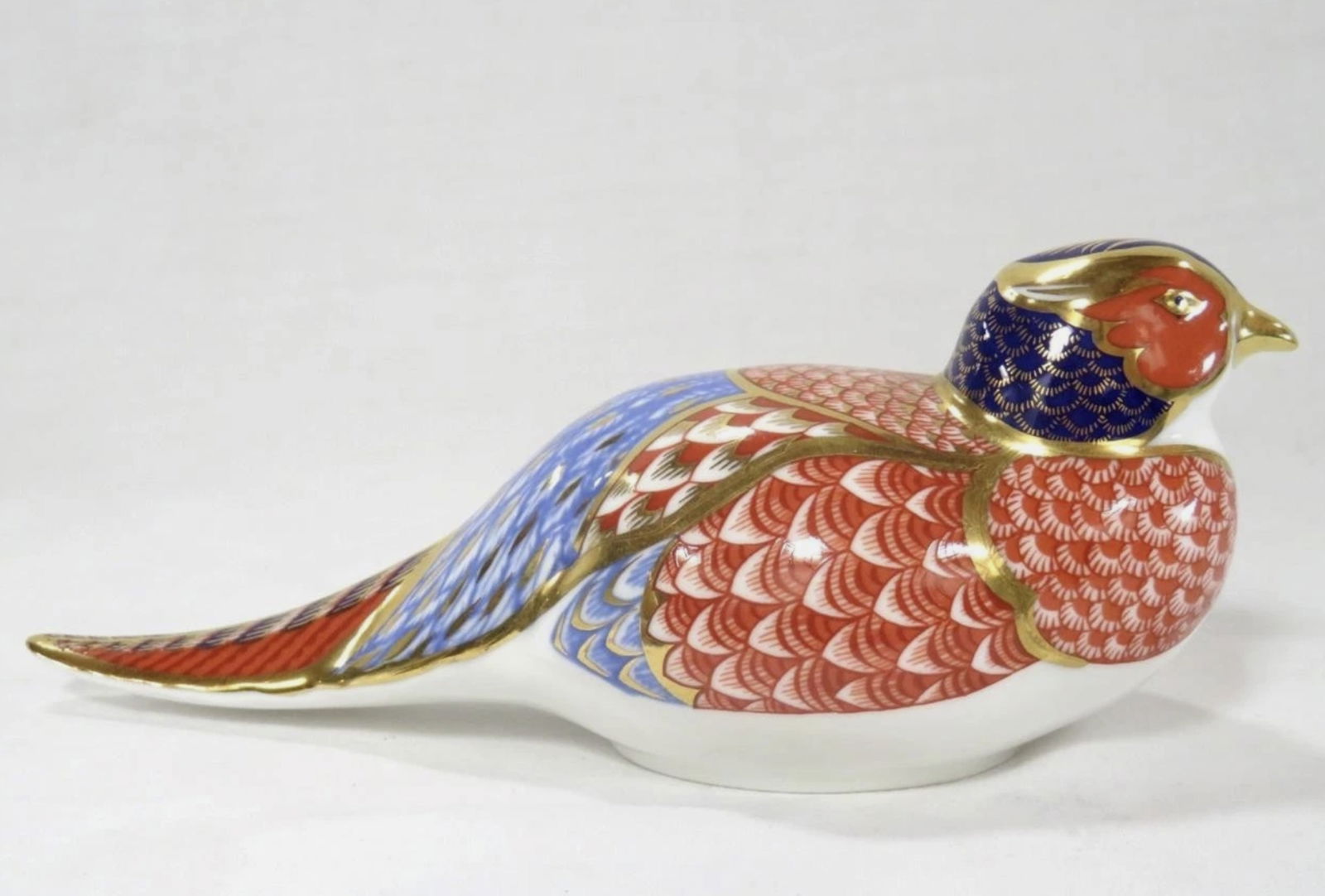 Royal Crown Derby Imari Pheasant Bird Gold Trimmed Paperweight Figurine: Royal Crown Derby Imari Pheasant Bird Gold Trimmed Paperweight Figurine.It measures approximately 7" wide x 3" deep x 2.75" high. No Chips or cracks