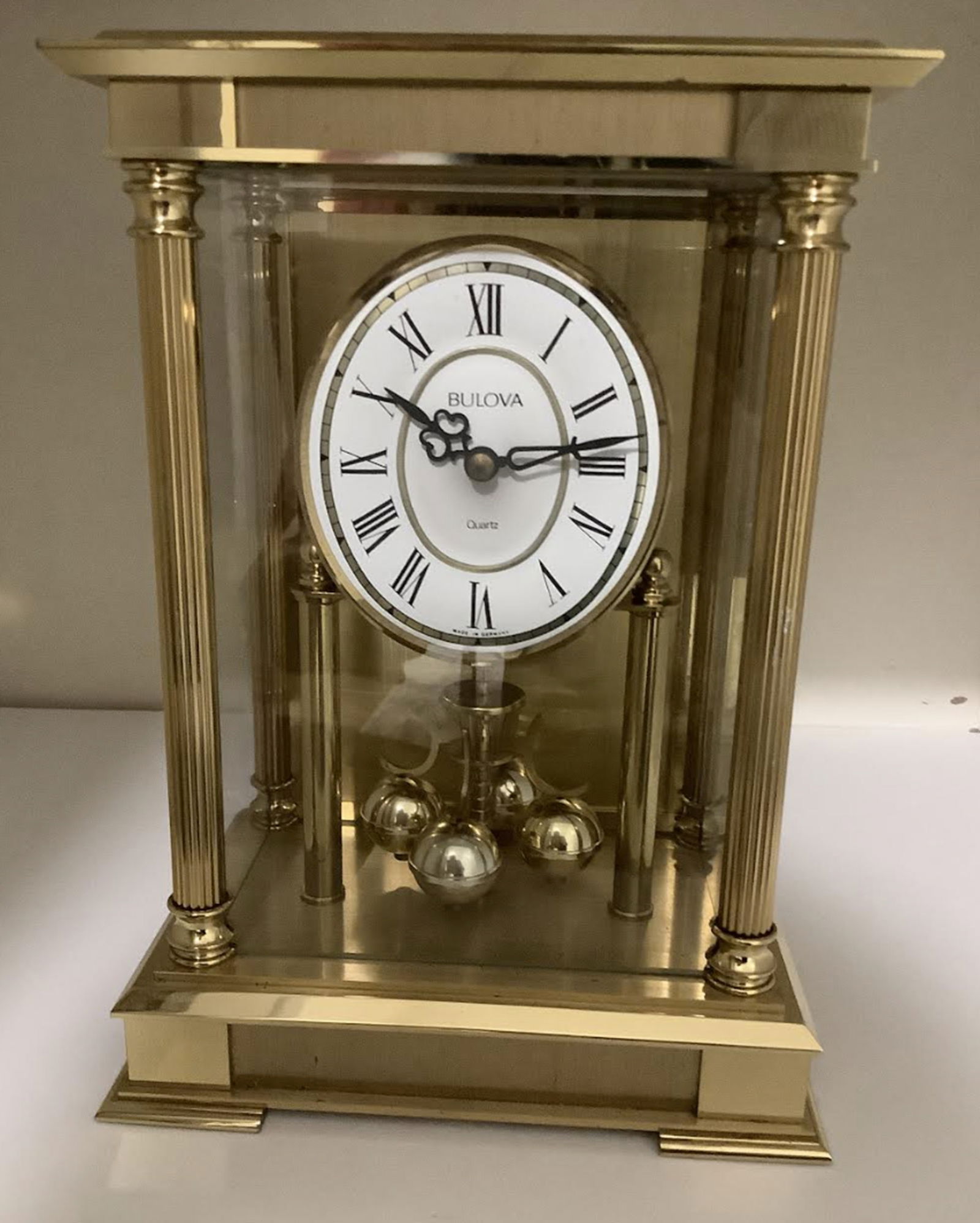 Bulova Quartz Brass Pendulum Clock Made in Germany: Bulova Quartz brass pendulum clock Made in Germany. The clock has been untested conditon is beautifulMeasures appron 9.5 inches tall and 6.5 wide