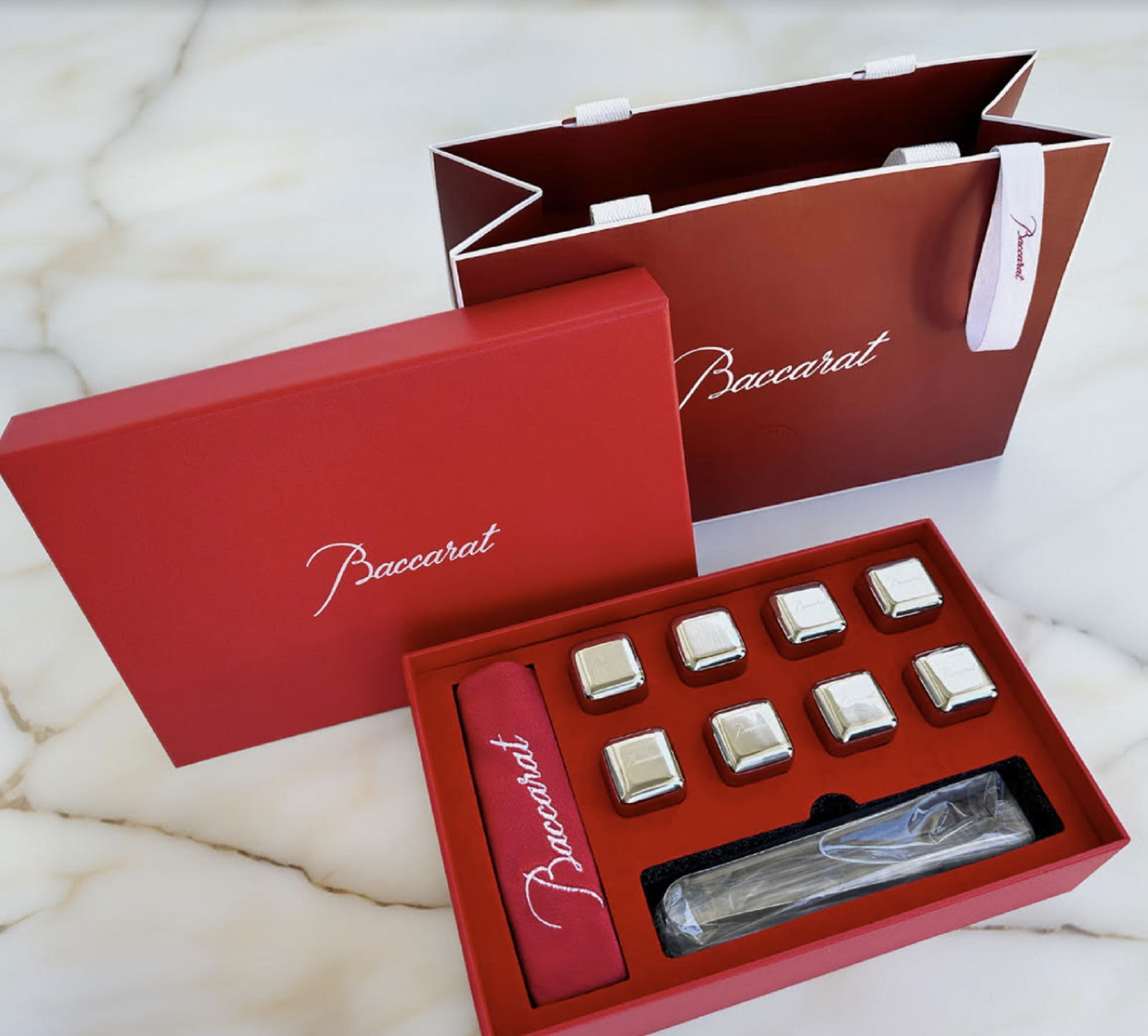 Baccarat Whiskey Stones Gift Set - 8 Steel Stones, Tongs in Orig Box: Baccarat Whiskey Stones Gift Set - 8 Steel Stones, Tongs in Orig Box this set includes Baccarat tongs for effortless handling, all presented in a stunning gift box (5 7/8" x 8 3/4" x 2 3/8")