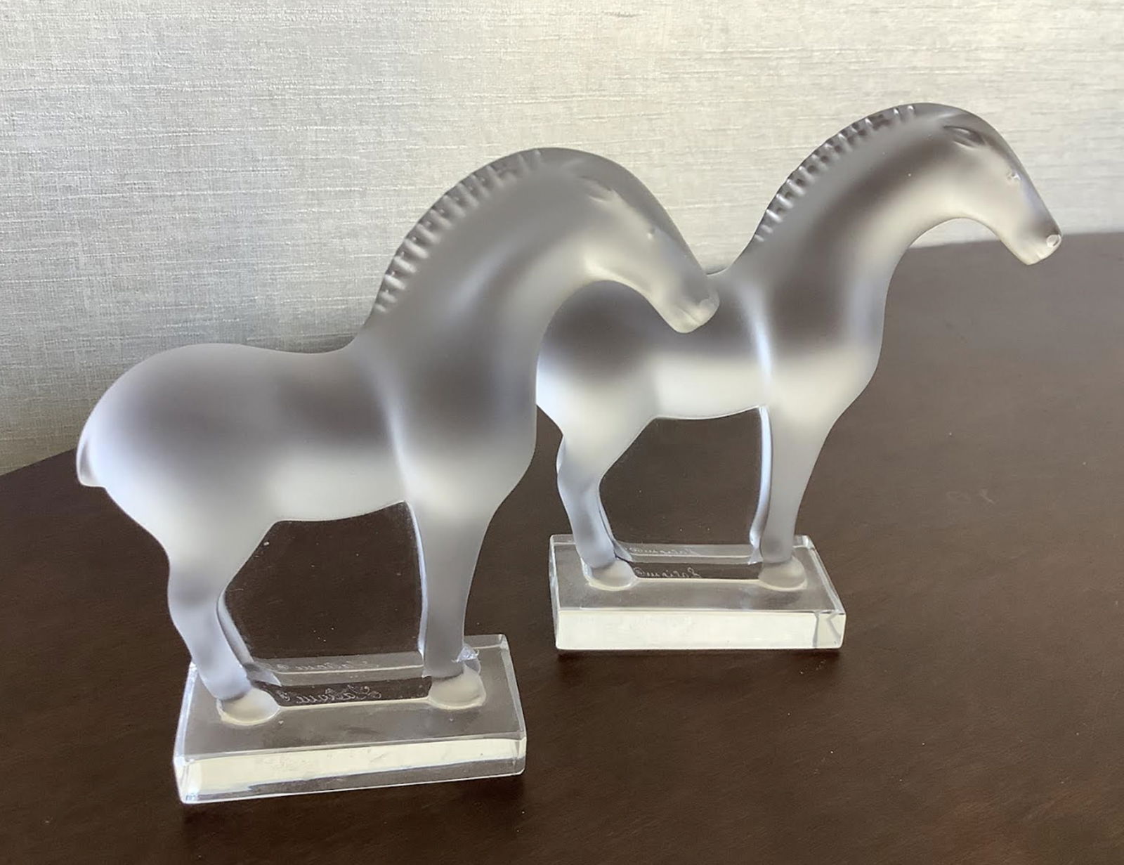 Lalique Signed Pair Tang Horse Figurines MAde in France: Lalique Signed Pair Tang Horse Figurines Made in France. Each Measures approx no chips or cracks present. Measures approx 3 1/2” X 4”