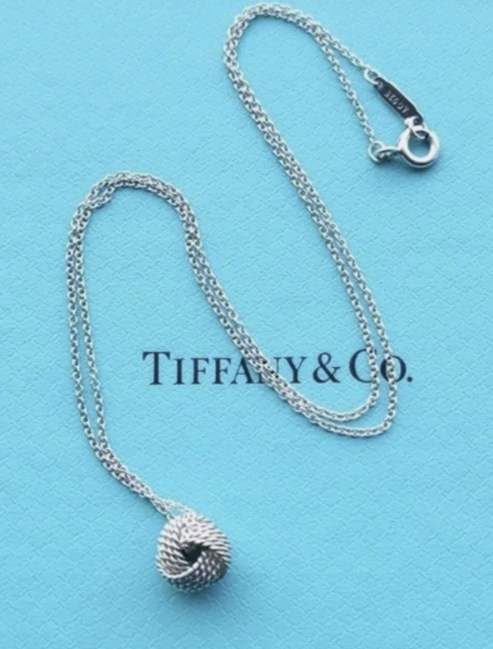 Tiffany & Co. Sterling Silver Somerset Mesh Knot Necklace With Box: Tiffany & Co. Sterling Silver Somerset Mesh Knot Necklace With Box. This elegant pendant necklace features a intricate mesh knot design from the Tiffany & Co. Somerset collection. Chain Measures appro