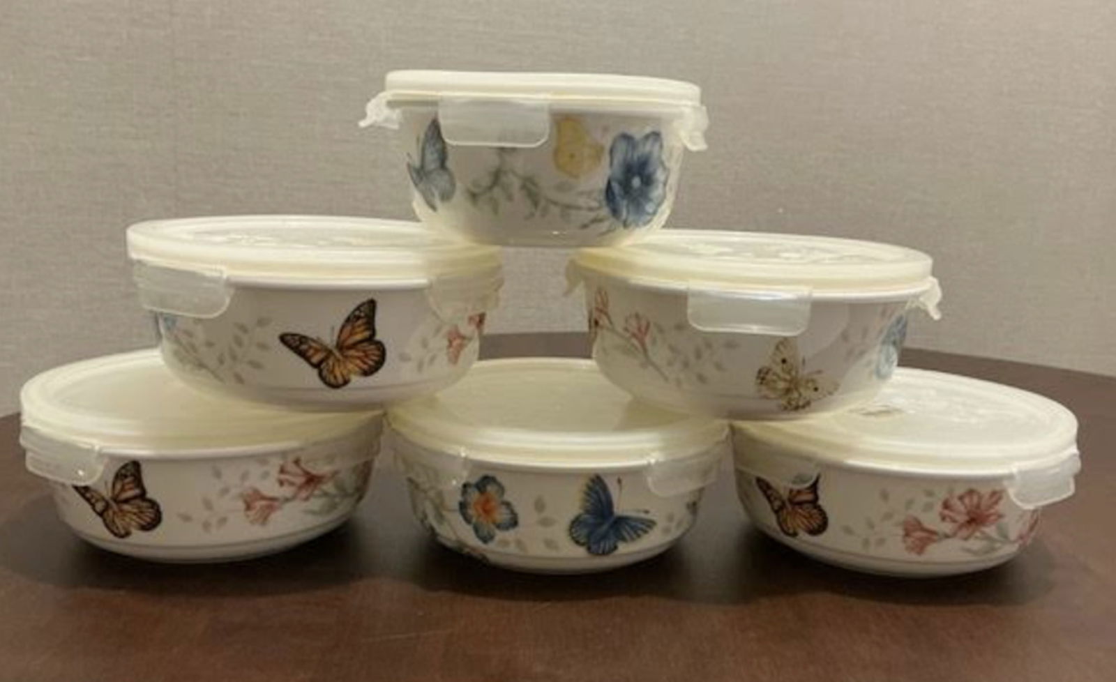 Lenox Set of Porcelain Canisters with lids: Lenox Set of Porcelain Canisters with lids. 5 measure approx 6 inches wide and 1 measures approx 5 inches wide