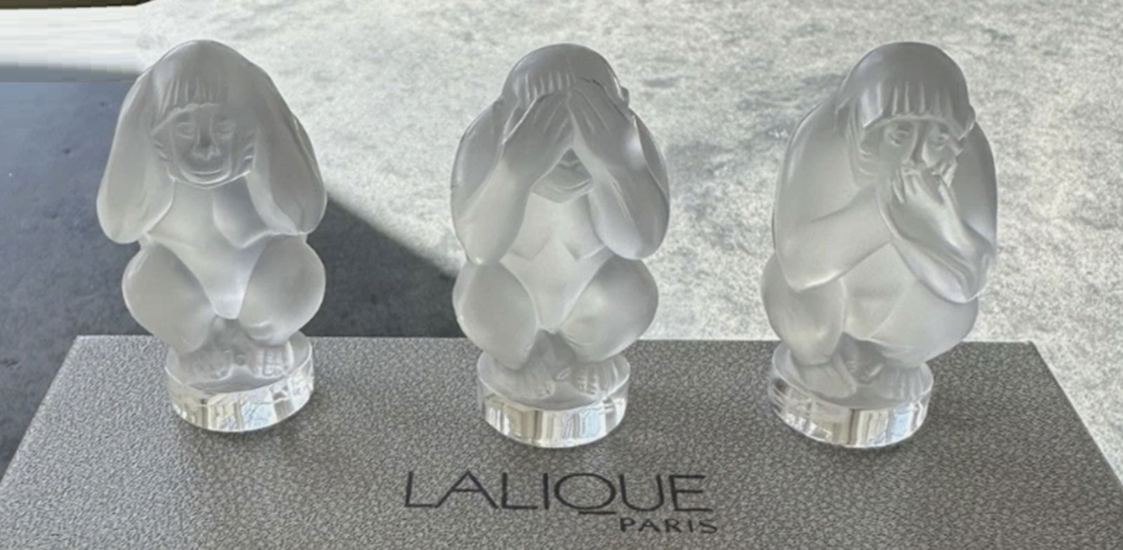 Lalique Signed Crystal Monkey Set Of 3 With Box: Lalique Signed Crystal Monkey Set Of 3 With Box. The Lalique Crystal Monkey Set Of 3 features exquisite French craftsmanship. These figurines are handcrafted from clear crystal, making them a stunning