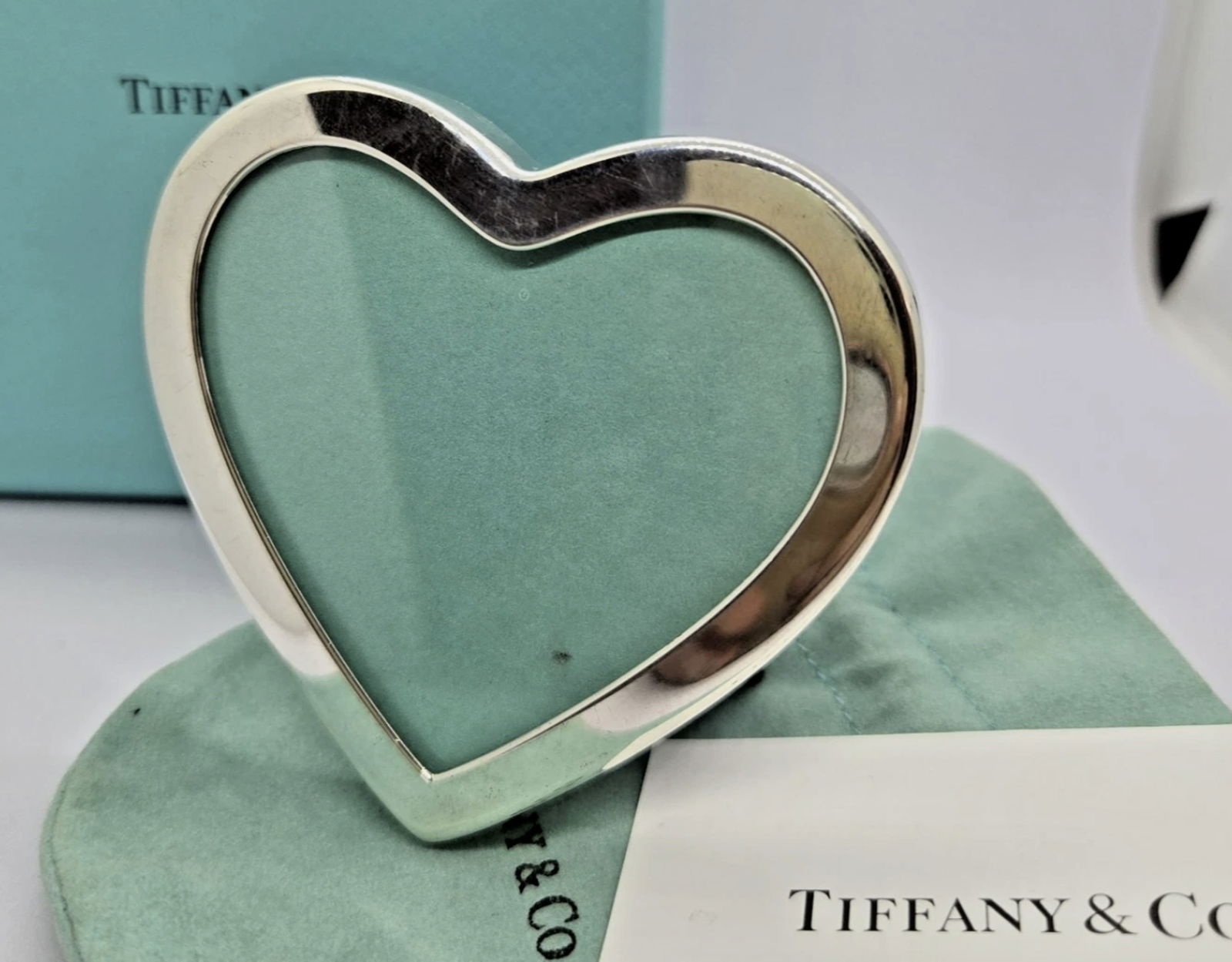 Tiffany & Co Sterling Silver Heart Picture Frame With Pouch and Box: Tiffany & Co Sterling Silver Heart Picture Frame With Pouch and Box Measures approx: Item Width2.5in Great condition