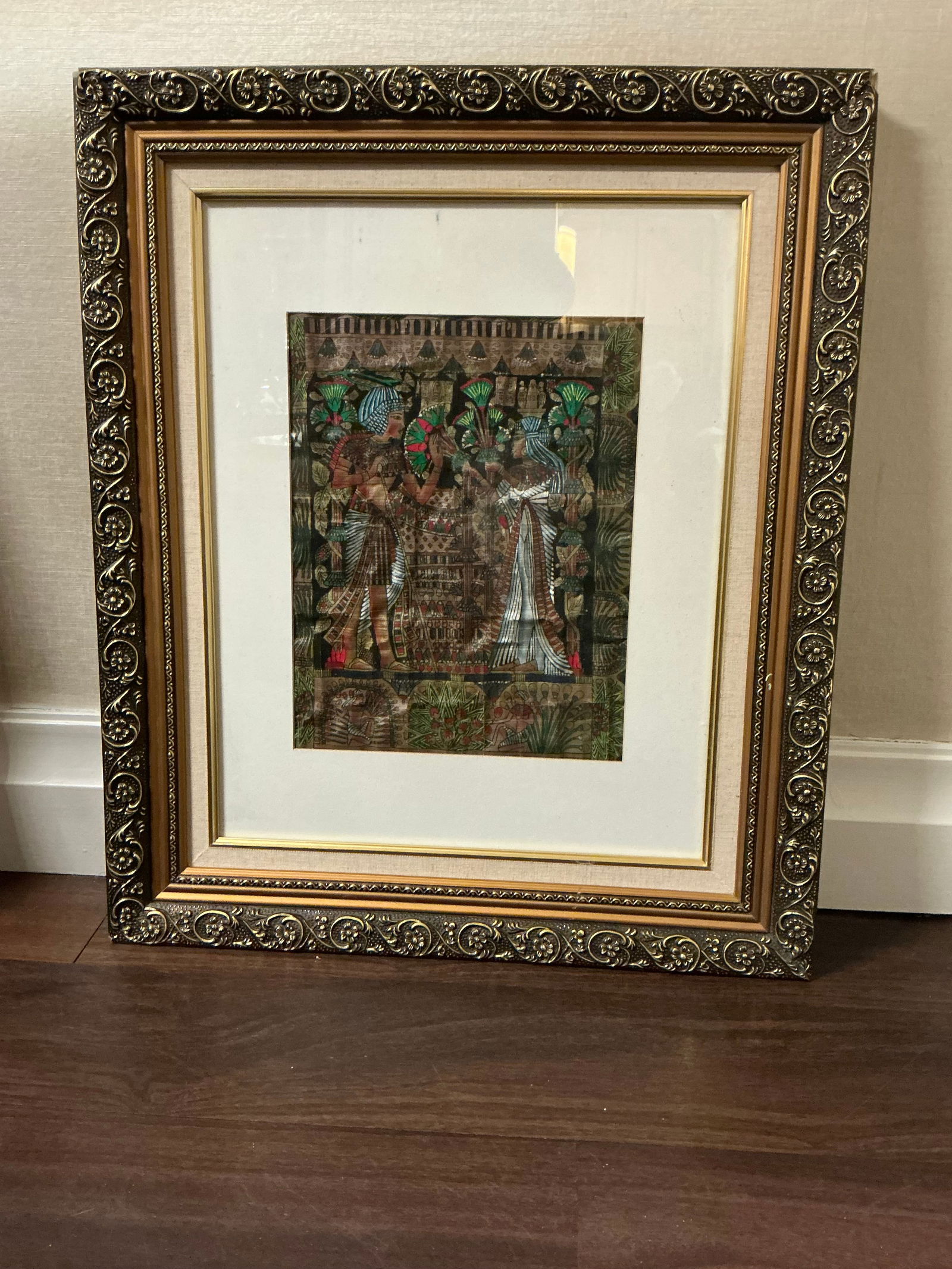 Framed Egyptian papyrus painting depicting the wedding scene of King Tutankhamun and Ankhesenamun: Framed Egyptian papyrus painting depicting the wedding scene of King Tutankhamun and Ankhesenamun. Frame Measures approx 22 inches wide X 26 inches high. art measures approx 10.5 inches x 13.5 inches