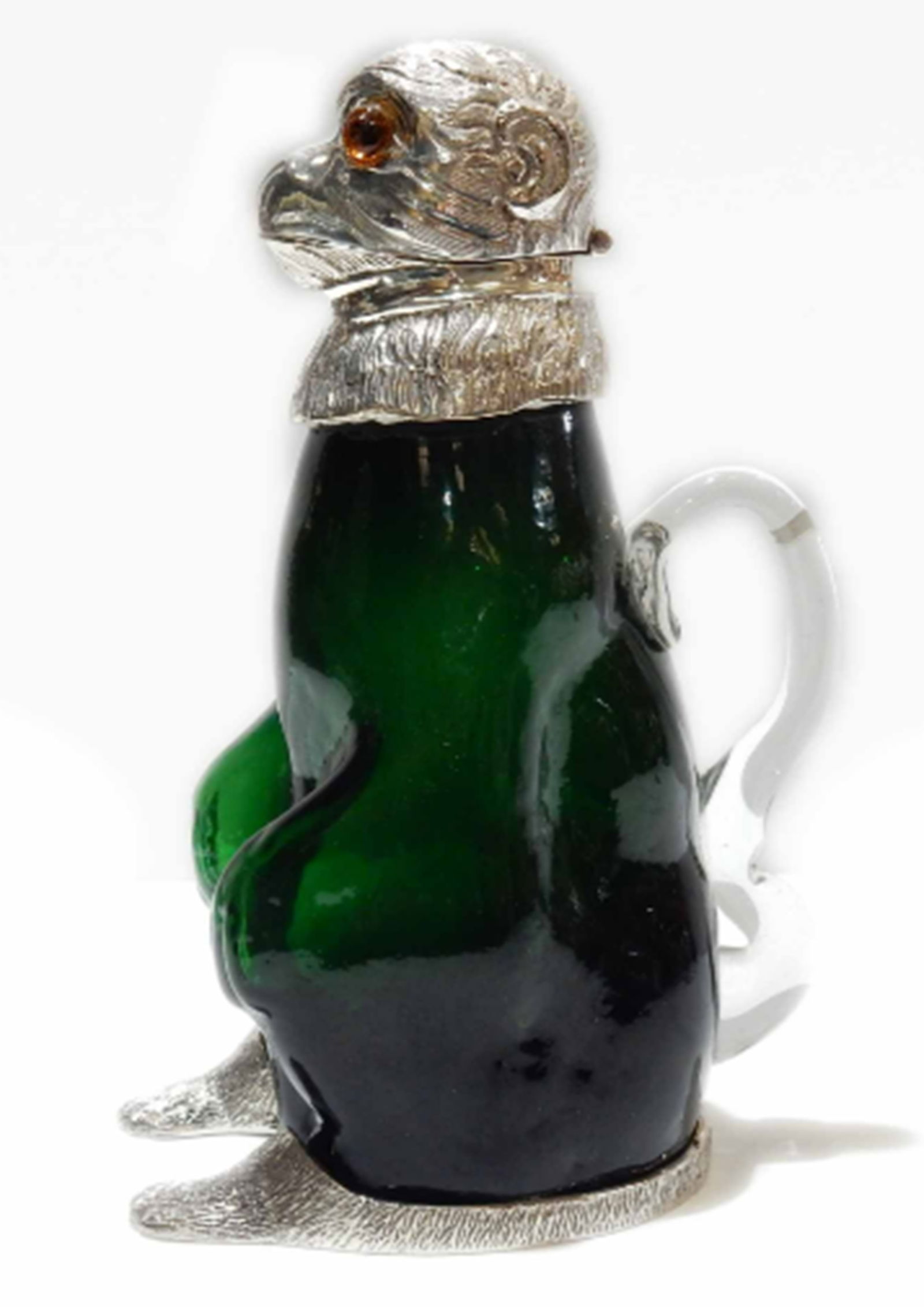 Victorian style French Emerald Monkey Emerald Decanter: Victorian style French Emerald Monkey Decanter. The glass body of the Monkey is a stunning green color. The Monkey has a silverplated head with glass eyes. The silverplate is stamped on the back of