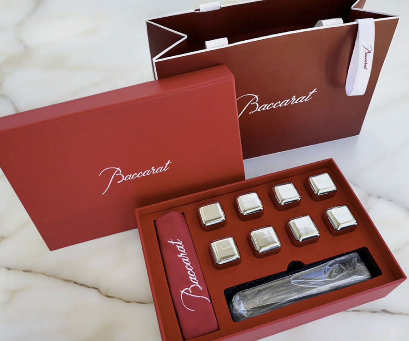 Baccarat Whiskey Stones Gift Set - 8 Steel Stones, Tongs in Orig Box: Baccarat Whiskey Stones Gift Set - 8 Steel Stones, Tongs in Orig Box this set includes Baccarat tongs for effortless handling, all presented in a stunning gift box (5 7/8" x 8 3/4" x 2 3/8")