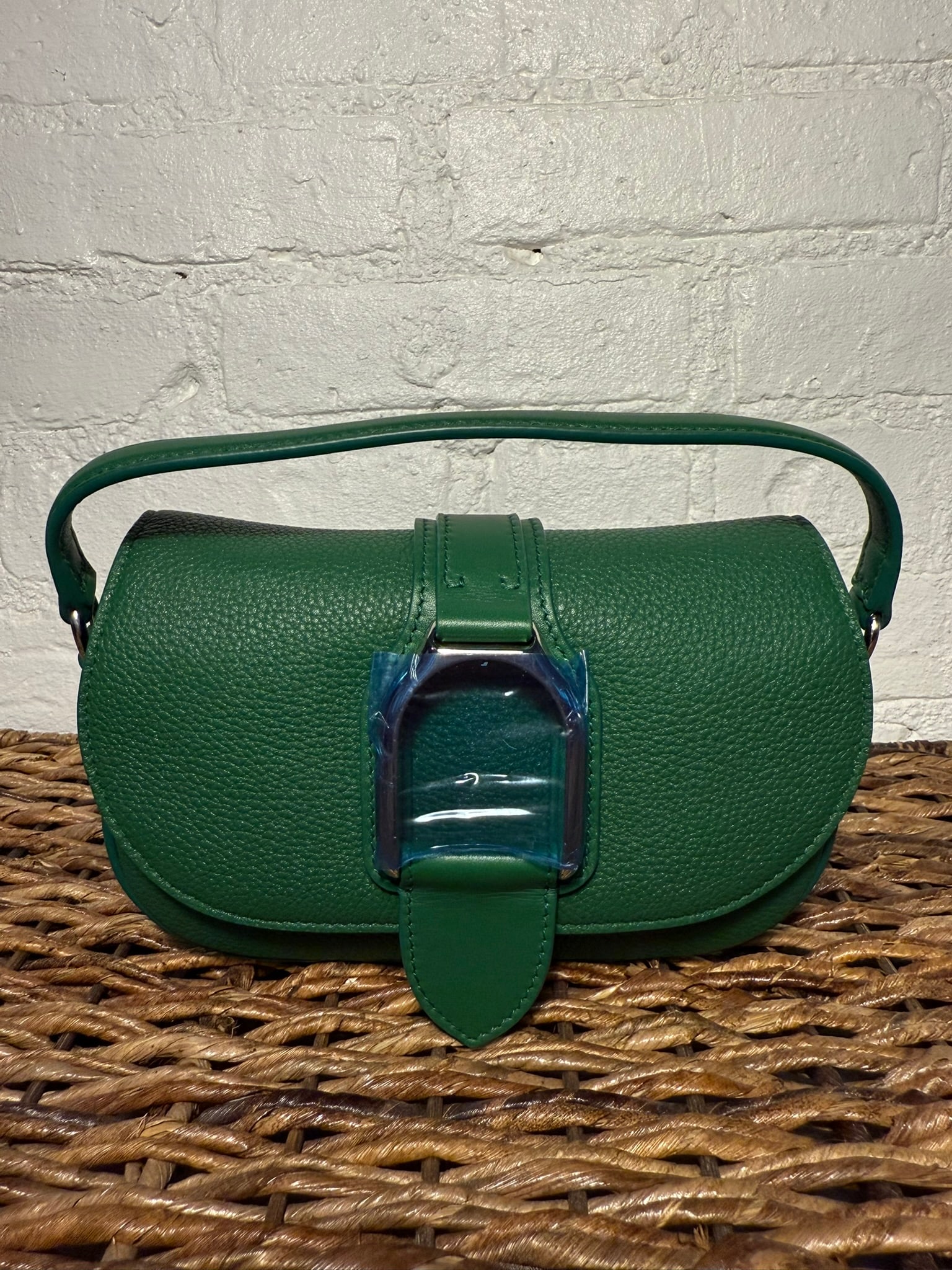 Ralph Lauren Collection Wellington Handbag: Ralph Lauren Collection Wellington Handbag Deep green leather. Comes with detachable shoulder strap and dust bag. New/unused with shipping protective film on stirrup hardware. Magnetic closure flap wi