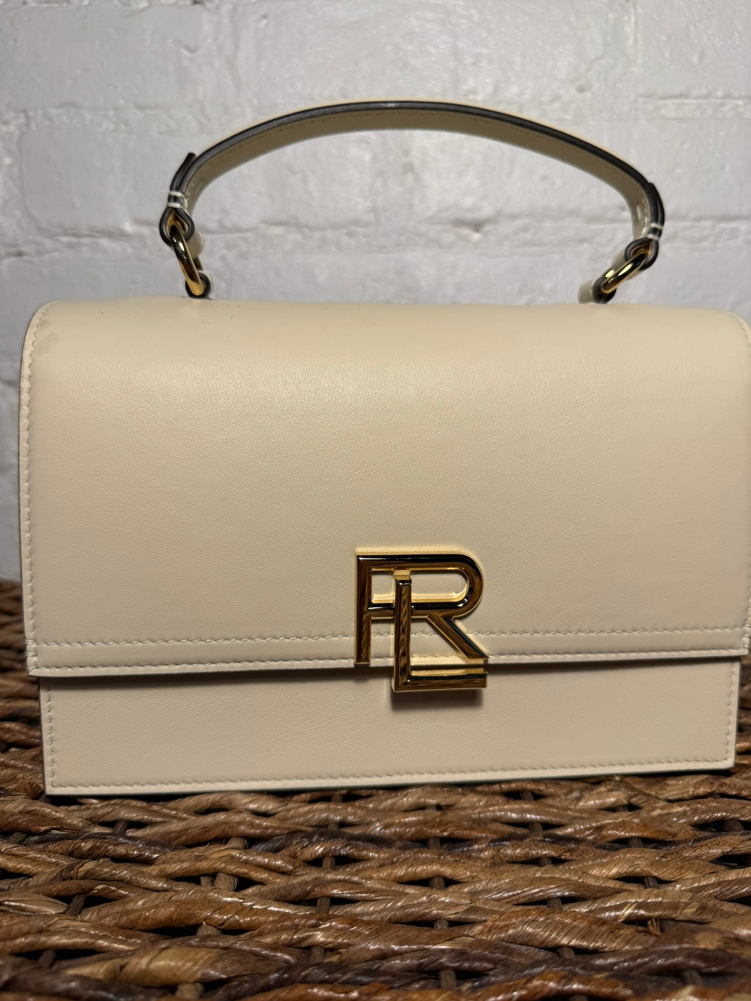 Ralph Lauren Collection Stacked RL Top Handle Bag: Ralph Lauren Collection Stacked RL Top Handle Bag Ivory leather construction. Includes detachable/adjustable crossbody strap & dust bag. External back pocket and internal pocket. Locking mechanism in