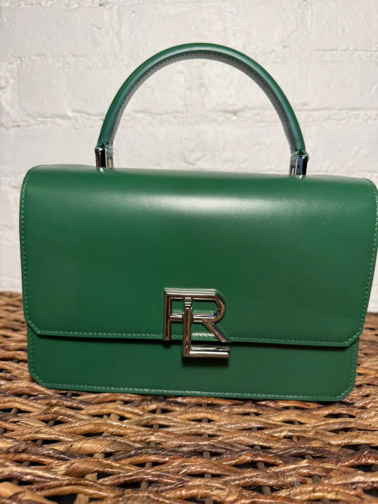 Ralph Lauren Collection Stacked RL Top Handle Bag: Ralph Lauren Collection Stacked RL Top Handle Bag Green leather construction. Includes detachable/adjustable crossbody strap. External back pocket and internal pocket. Locking mechanism in RL logo. Si