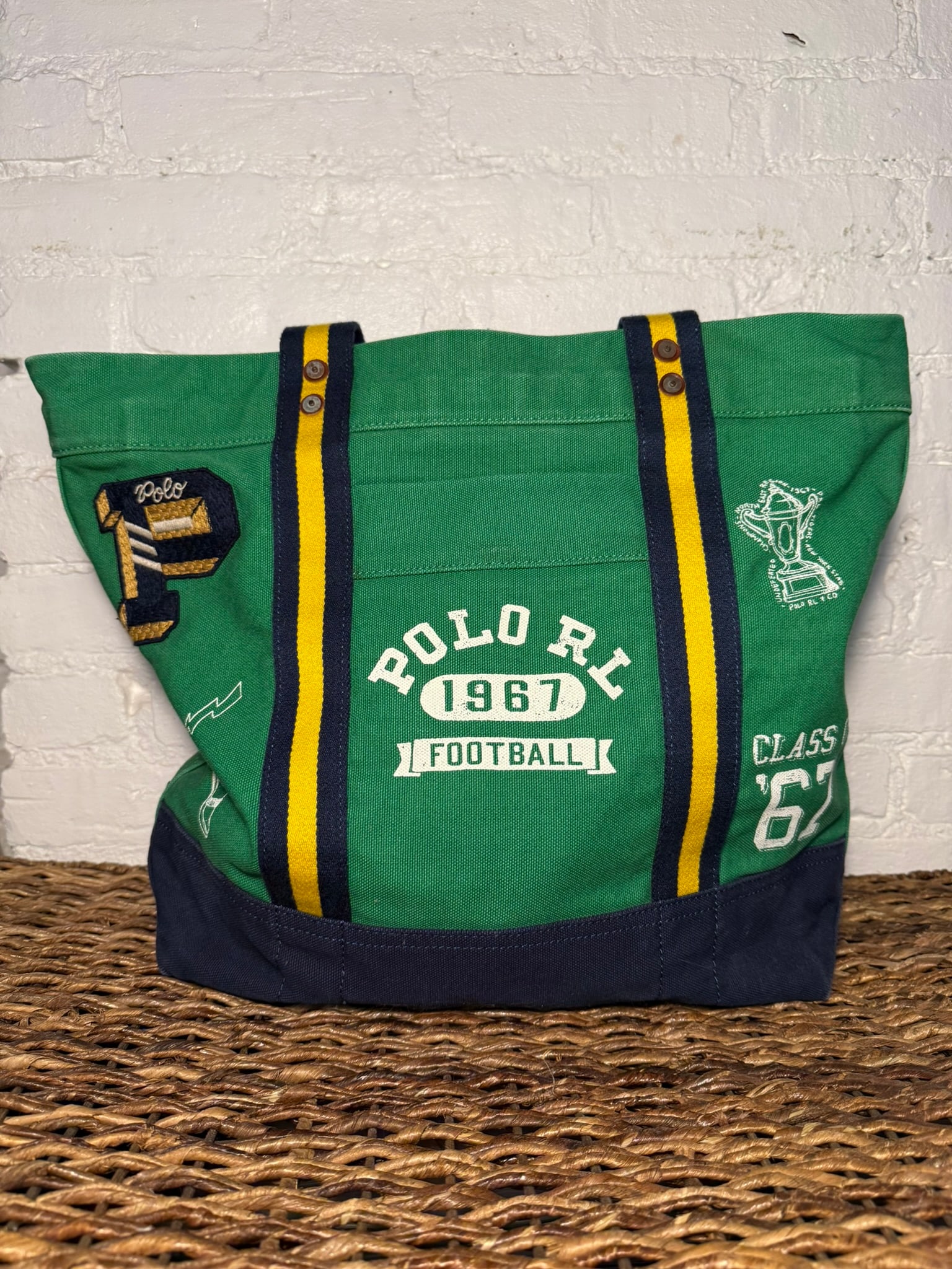 Polo Ralph Lauren Sporty Tote Bag: Polo Ralph Lauren Sporty Tote Bag Green canvas tote bag with printed and patchwork sports detailing. Zip closure with external and internal pockets. Like new, lightly used. Measures approx 14" x19" x