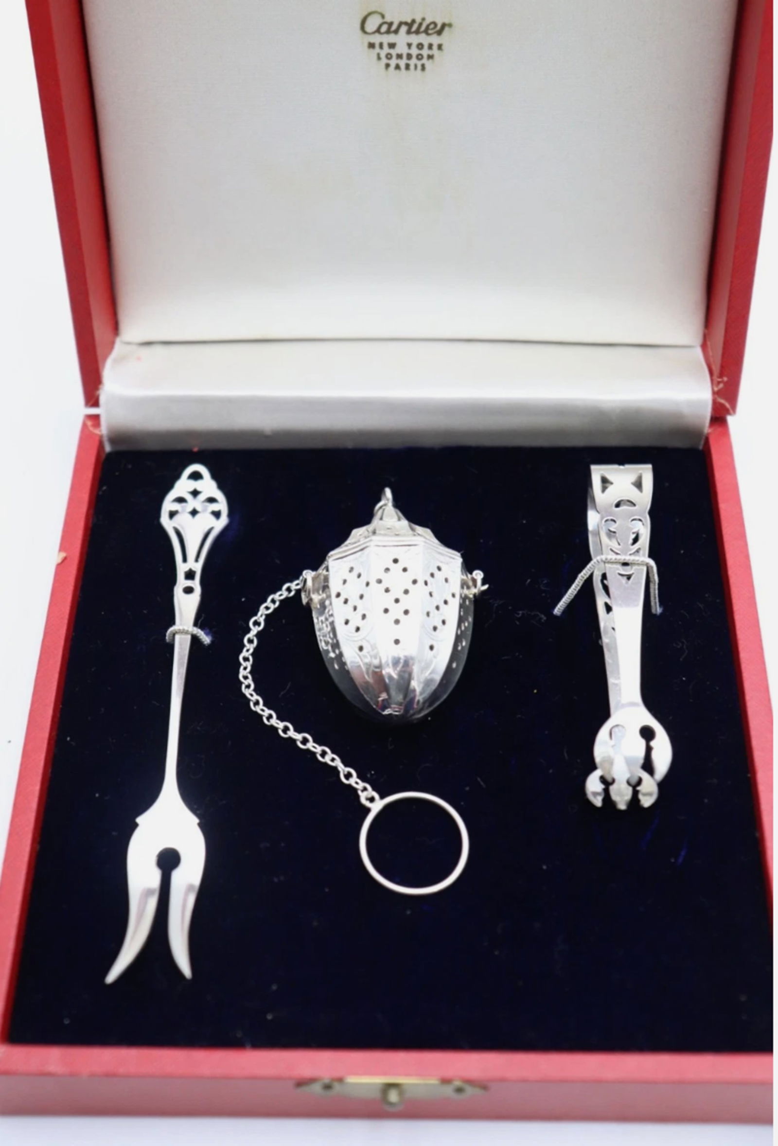 Cartier Sterling Silver Tea Set Tea Infuser Lemon Fork & Sugar Tongs in Orig Box: Cartier Sterling Silver Tea Set Tea Infuser Lemon Fork & Sugar Tongs in Orig Box Tongs & Fork are Marked Stering Webster & Cartier. The tea Infuser is marked Webster Sterling This Cartier tea set is a