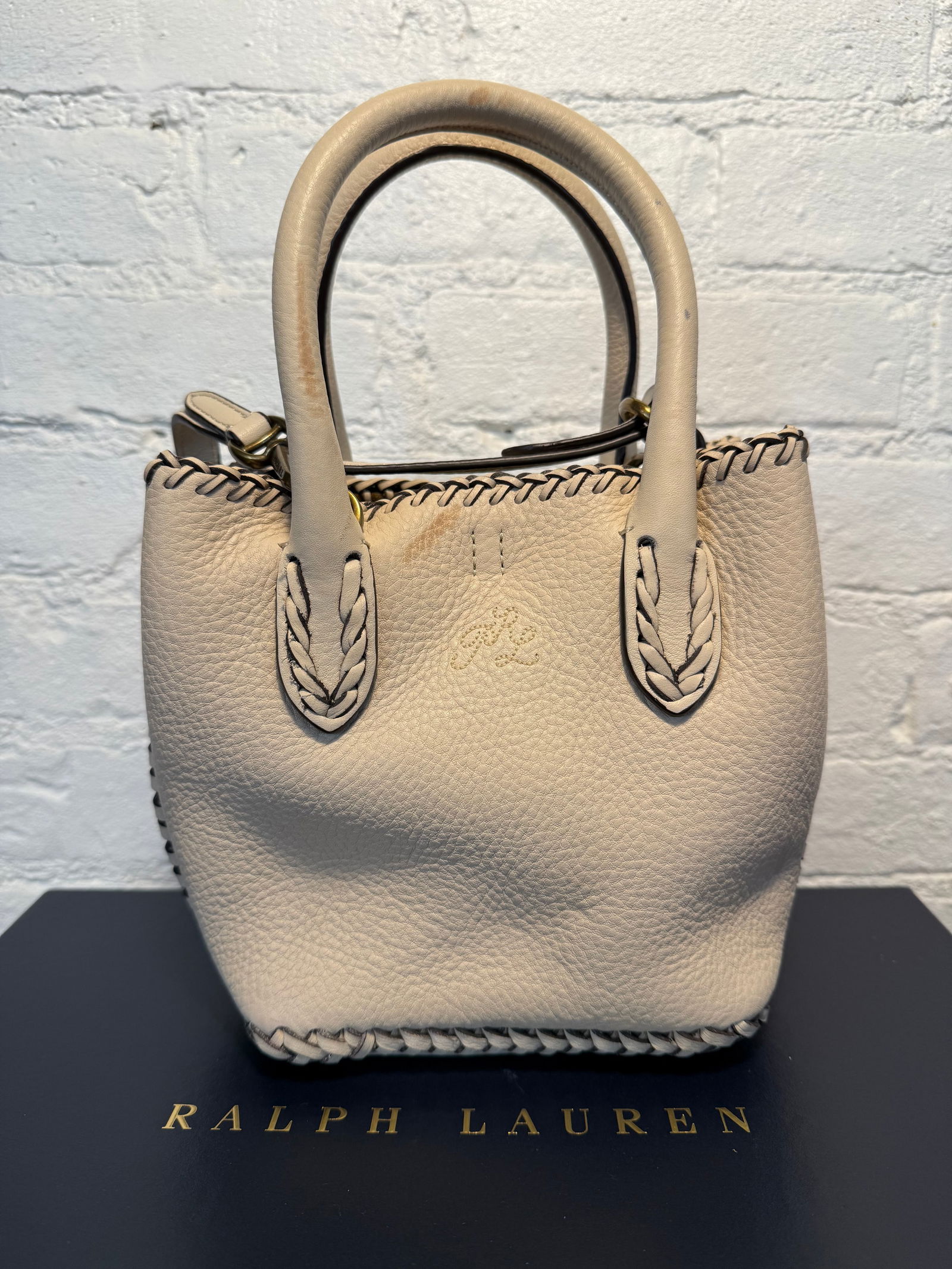 Polo Raph Lauren Mini bellport tote: Polo Raph Lauren Mini bellport tote Small bag with removable crossbody strap. Good used condition with stain shown inside the bag. Cream calfskin leather with western stitching Measures approx.9"x6"x4