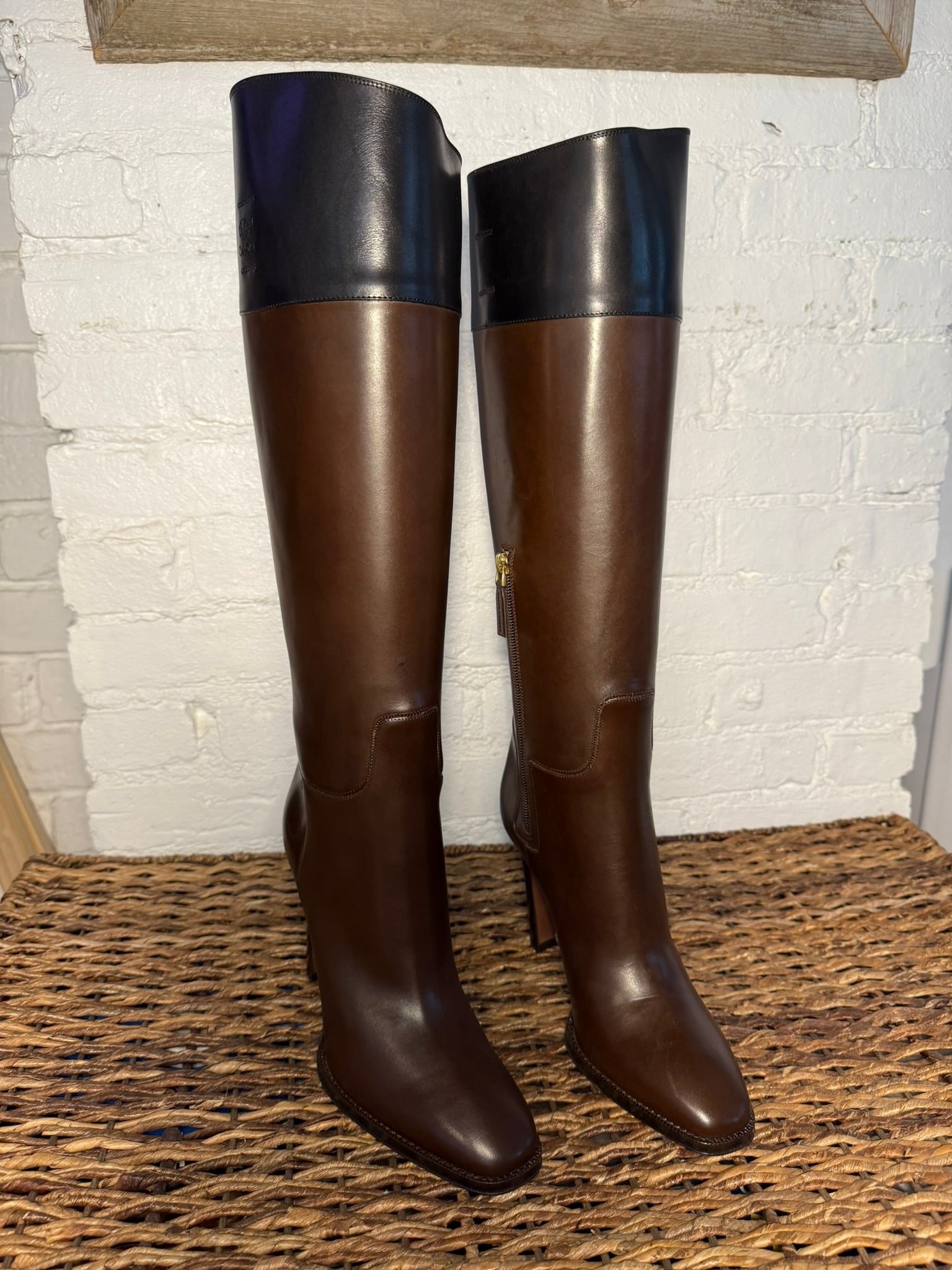 Ralph Lauren Collection Tall Two-Tone Heeled Boot: Ralph Lauren Collection Tall Two-Tone Heeled Boot Two tone dark cognac and black leather Collection boot. Stamped with RL logo. Internal strap to help pull on. Never worn, like new. Box has some damag