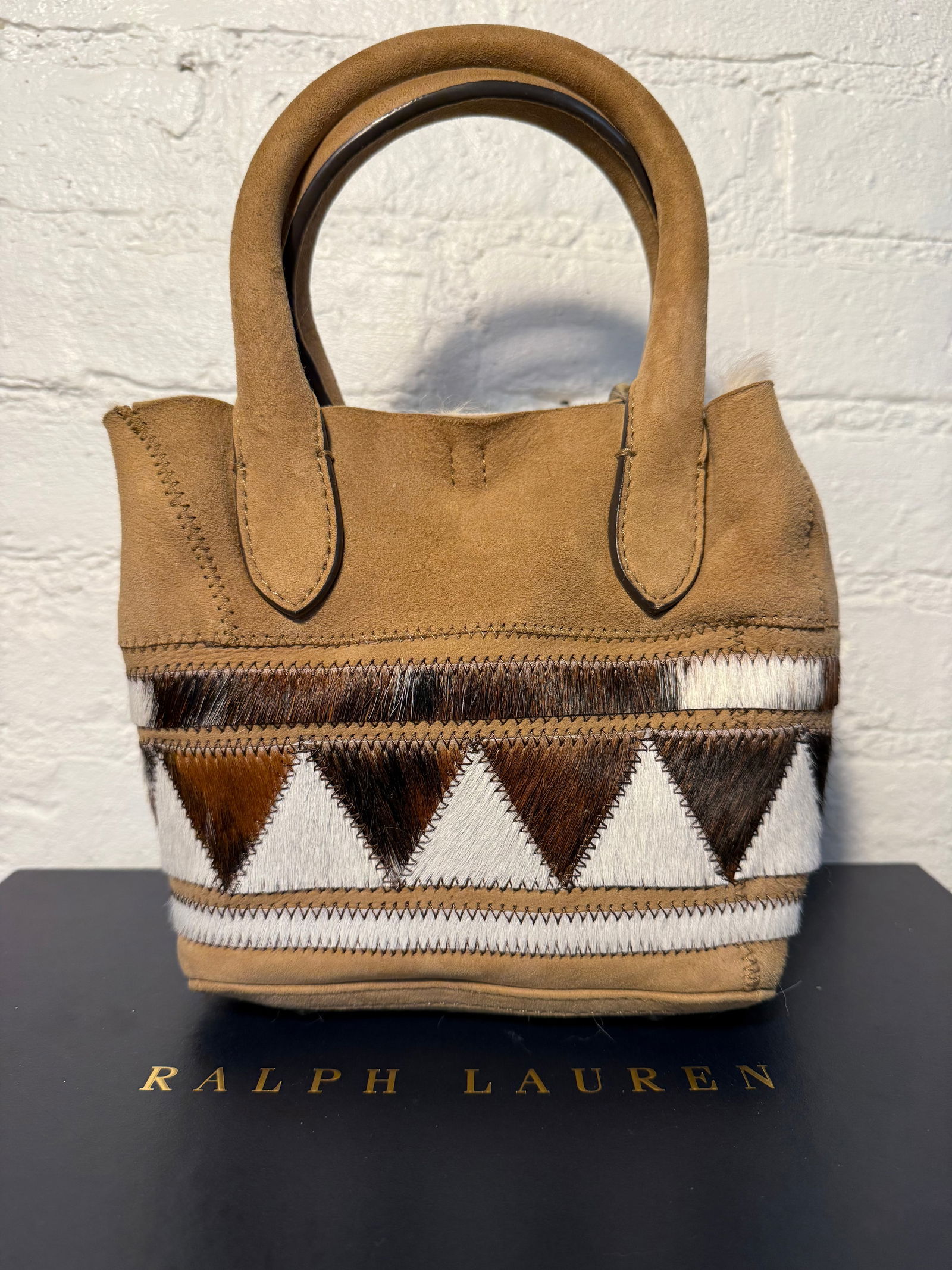 Mini Bellport Polo Ralph Lauren Bucket Bag: Mini Bellport Polo Ralph Lauren Bucket Bag Fur lined bucket bag with removable crossbody strap and one interior card pocket. Optional strap to close opening. New/unused Tan suede with muti colored pon