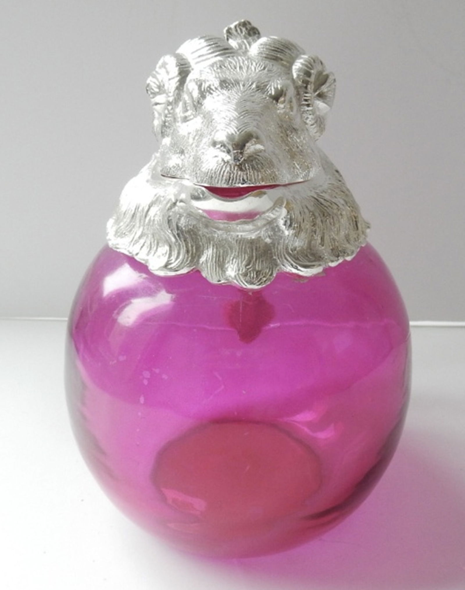 Victorian style French Ram Head Cranberry pink Decanter.: Victorian style French Ram Head Cranberry pink Decanter. The glass body of the Bulldog is a stunning cranberry/pink color. The Ram has a silverplated head with glass eyes. The silverplate is stamped