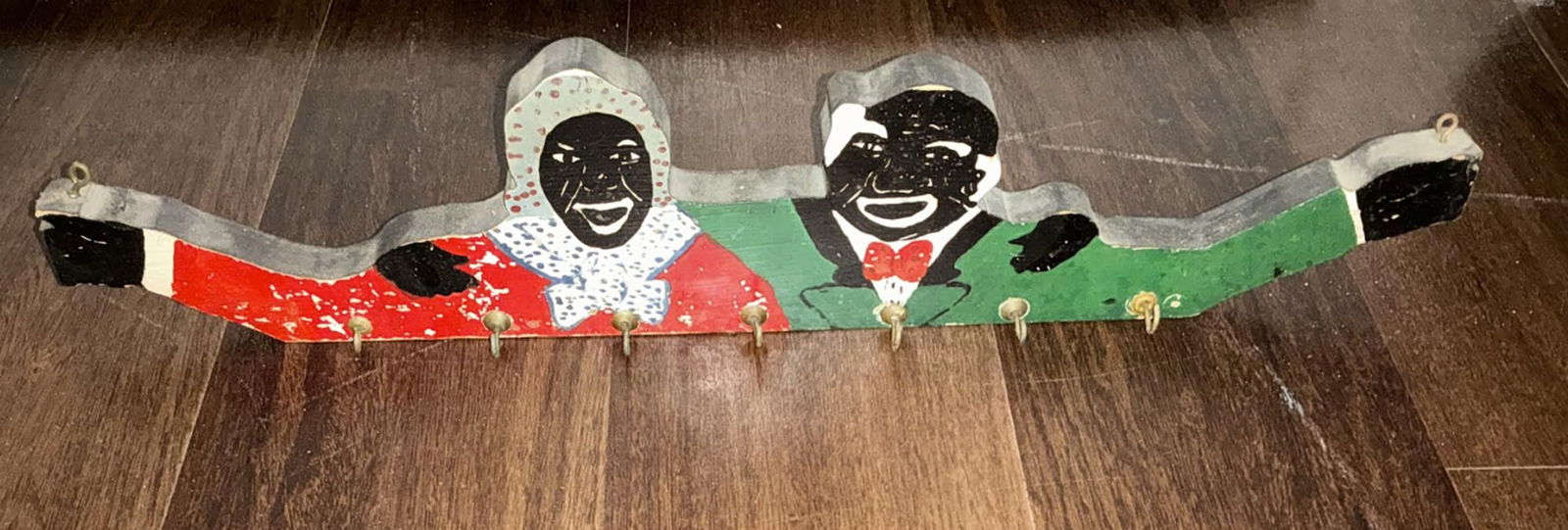 Black Americana Era wooden wall hook rack: Black Americana Era wooden wall hook rack . Measures approx 20.5 inches wide wood painted with hooks