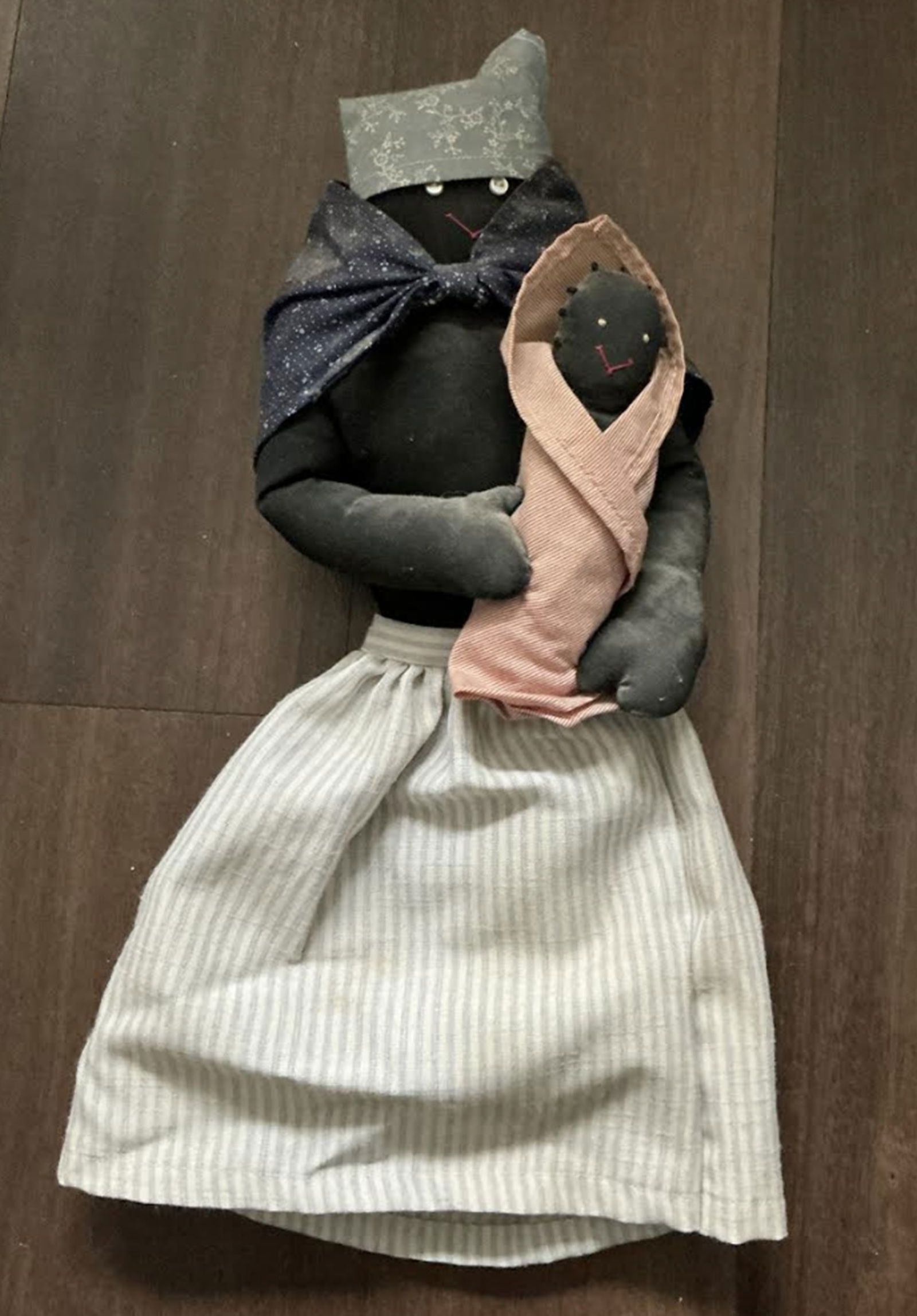 Black Americana Era Cloth Rag Doll: Black Americana Era cloth Rag doll. Measures approx 15.5 inches long with the dress. This item is a handcrafted African American folk art rag doll, typically designed to represent a mother figure carr