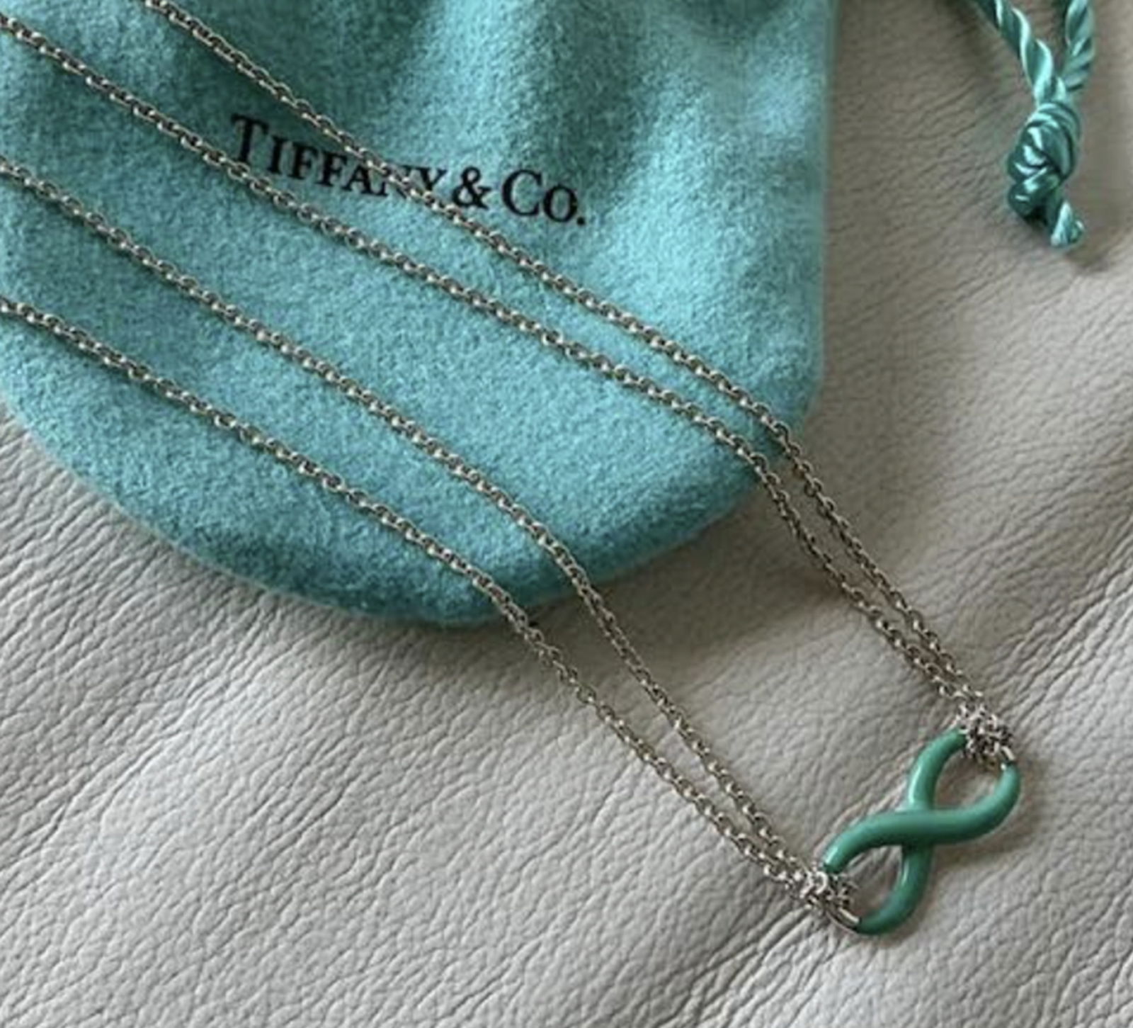 Tiffany & Co. Sterlling Silver Blue Enamel Infinity Double Chain Necklace 18 With Pouch: Tiffany & Co. Sterlling Silver Blue Enamel Infinity Double Chain Necklace 18 With Pouch Chain(Approx.): 18" (46cm) Charm size(Approx.): 0.3" (8mm) x 0.8" (20mm)Weight(Approx.): 5.7 grams