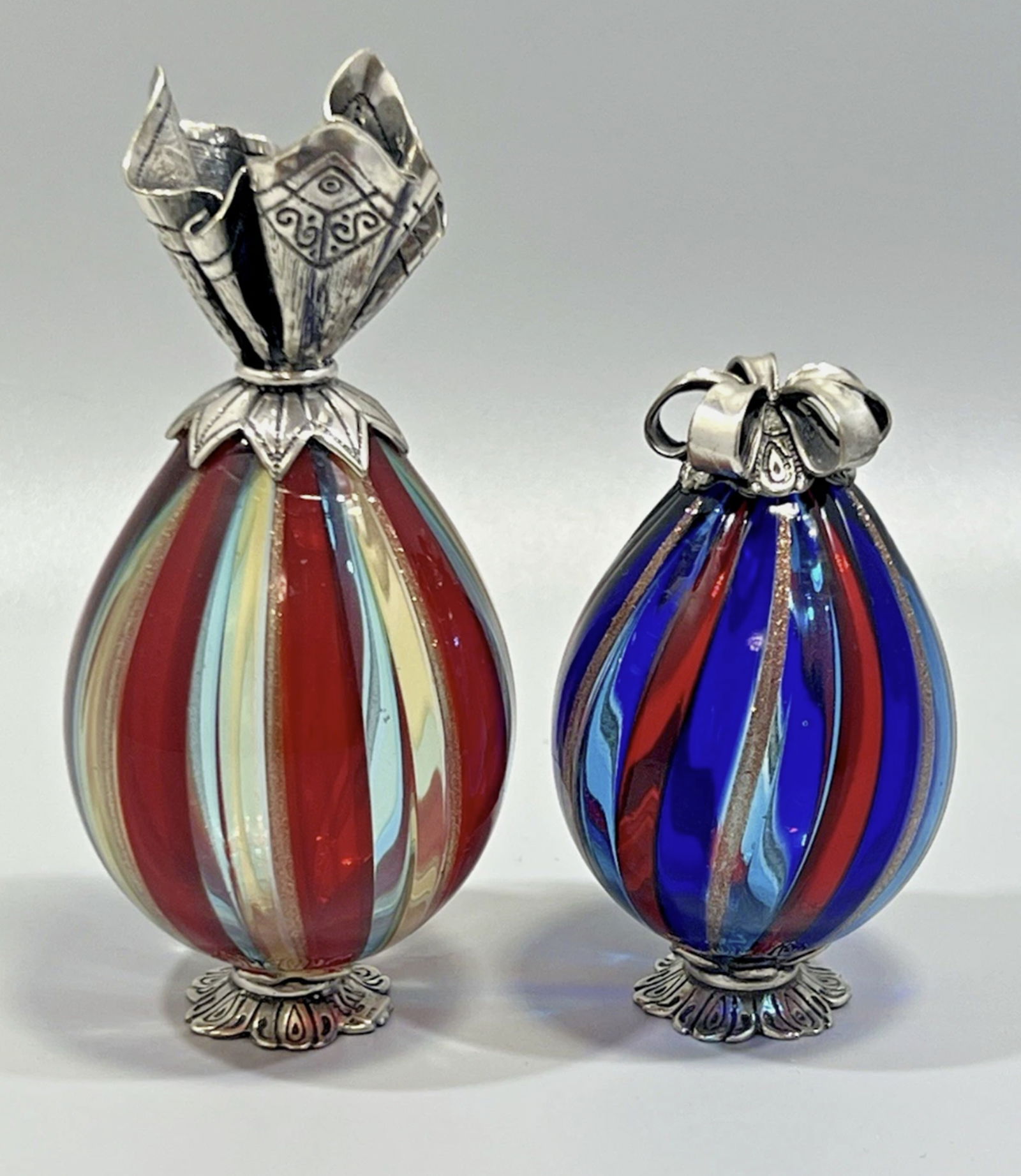 Sorini, Vittorio Angini Murano Glass Silver 800 Holiday Gift Bags Set of 2: Sorini, Vittorio Angini Murano Glass Silver 800 Holiday Gift Bags Set of 2. 1. Height 4.72", Width 2.17 and Depth 2.17" Silver #8002. Height 3", Width 2", and Depth 2" Silver #800Preowned item in exce