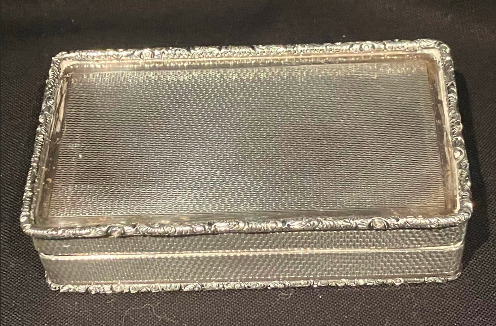 Birmingham Sterling Silver Box: Birmingham. Birmingham Sterling Silver 1975, engine turned on all exterior surfaces with intricate edge top and bottom. Interior gilded. measures approx 3 ¼”L x 1 ?”W x