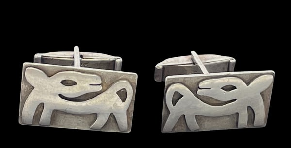 Pair of Mexican Sterling Silver Cufflinks with Dog Motifs: Pair of Mexican sterling silver cufflinks with applied dog motifs. They measure 1'' by 2/3'' in width by 3/4'' in depth and bear hallmarks as shown.